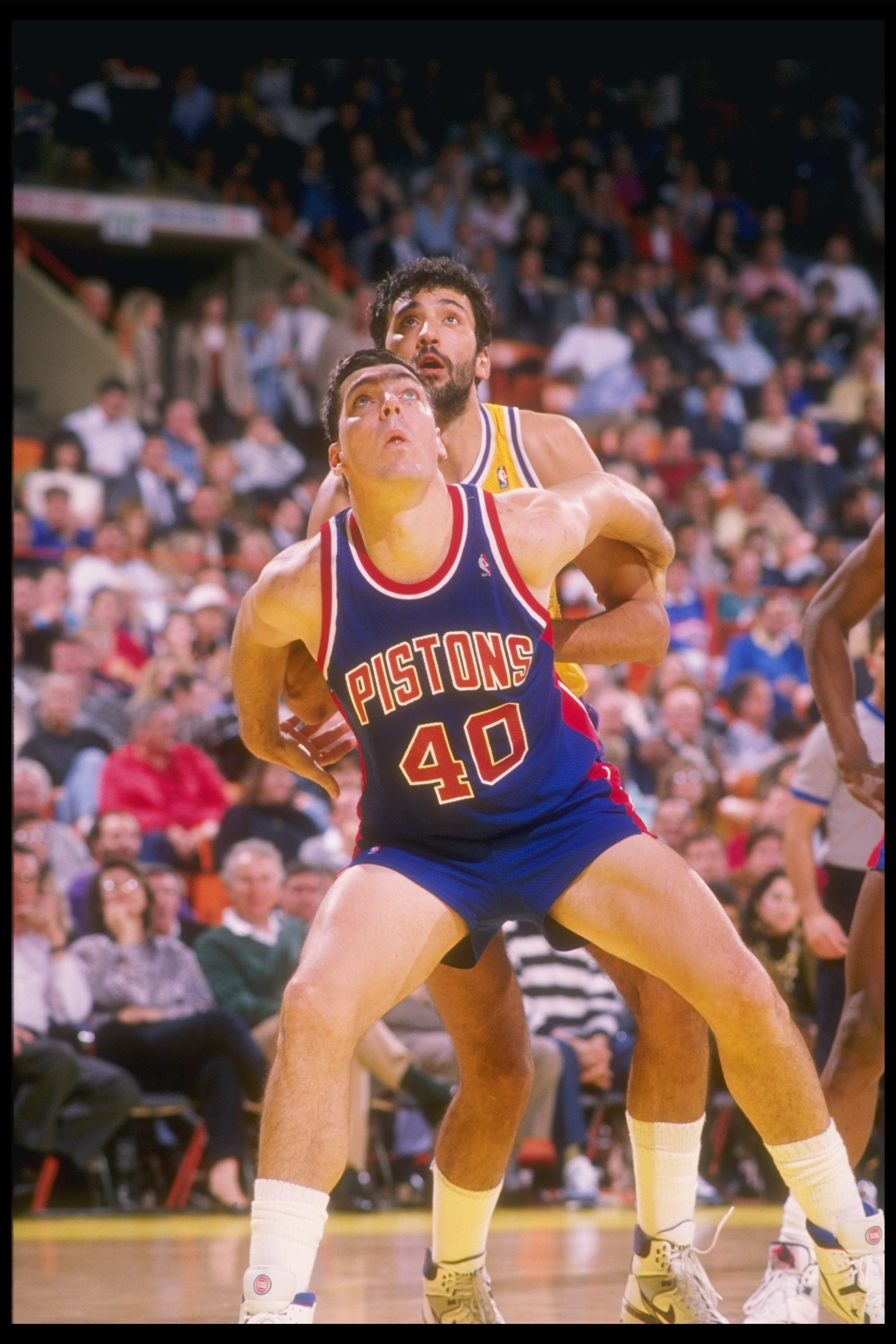 1989-1990:  Bill Laimbeer of the Detroit Pistons looks for the ball during a game. Mandatory Credit: Mike Powell  /Allsport Mandatory Credit: Mike Powell  /Allsport