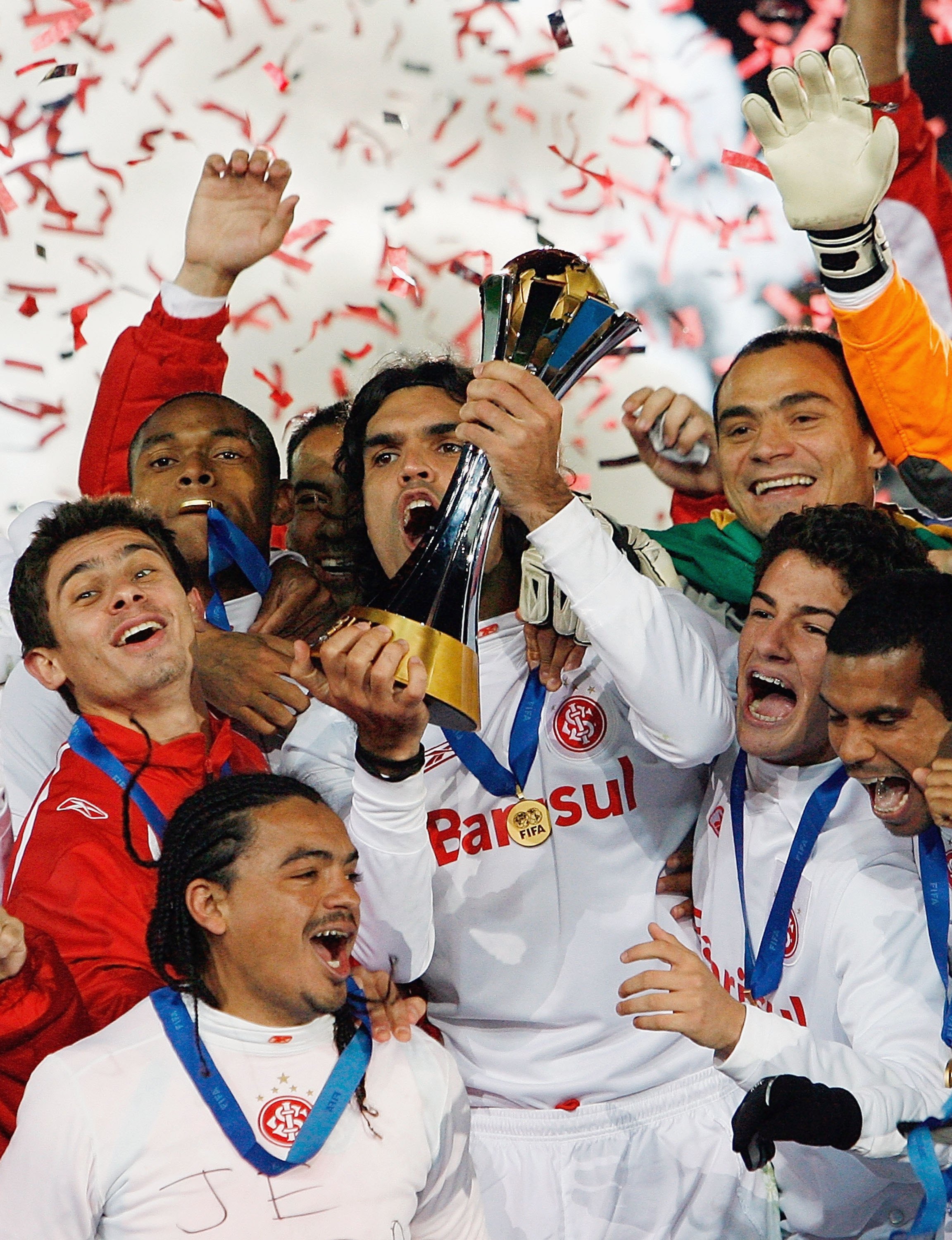 YOKOHAMA, JAPAN - DECEMBER 17:  Sport Club Internaciona players celebrate with the cup after winning the final of the FIFA Club World Cup Japan 2006 between Sport Club Internacional and FC Barcelona at the International Stadium Yokohama on December 17, 20