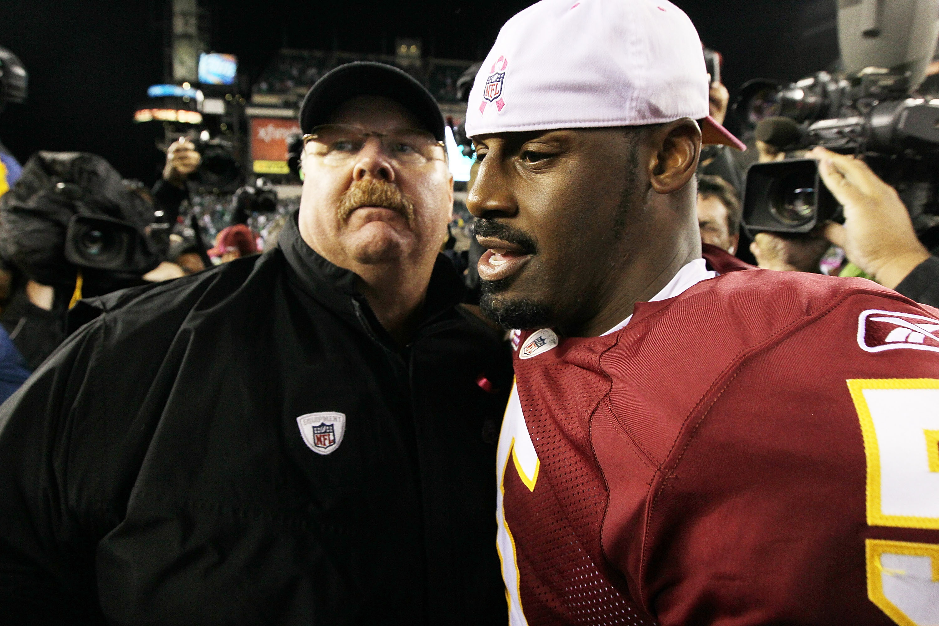 PHILADELPHIA - OCTOBER 03:  Donovan McNabb #5 of the Washington Redskins meets with head coach Andy Reid of the Philadelphia Eagles after their game on October 3, 2010 at Lincoln Financial Field in Philadelphia, Pennsylvania. The Redskins defeated the Eag