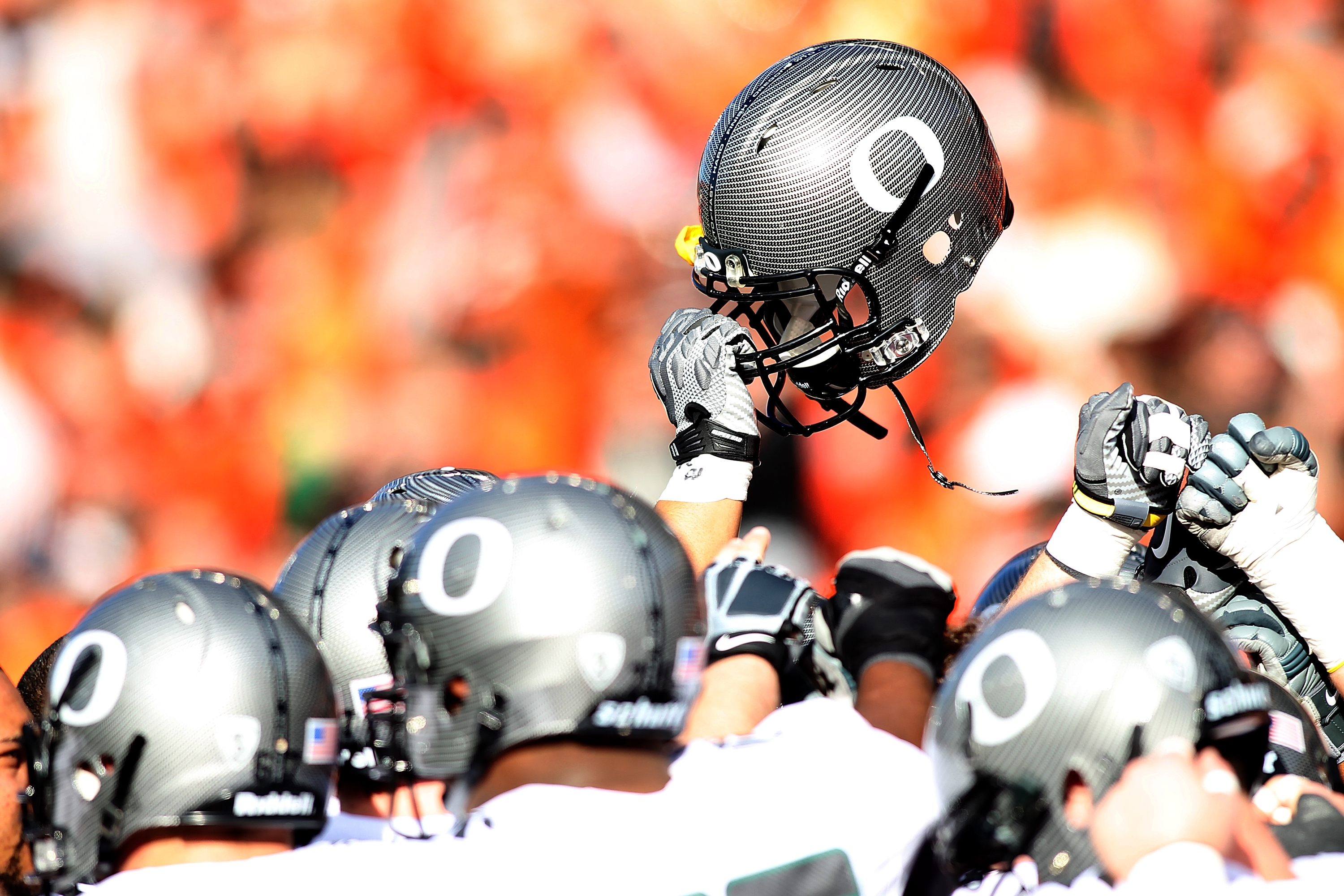 CORVALLIS, OR - DECEMBER 04: The Oregon Ducks hold their helmets high before the game against  the Oregon State Beavers during the 114th Civil War on December 4, 2010 at the Reser Stadium in Corvallis, Oregon.  (Photo by Jonathan Ferrey/Getty Images)