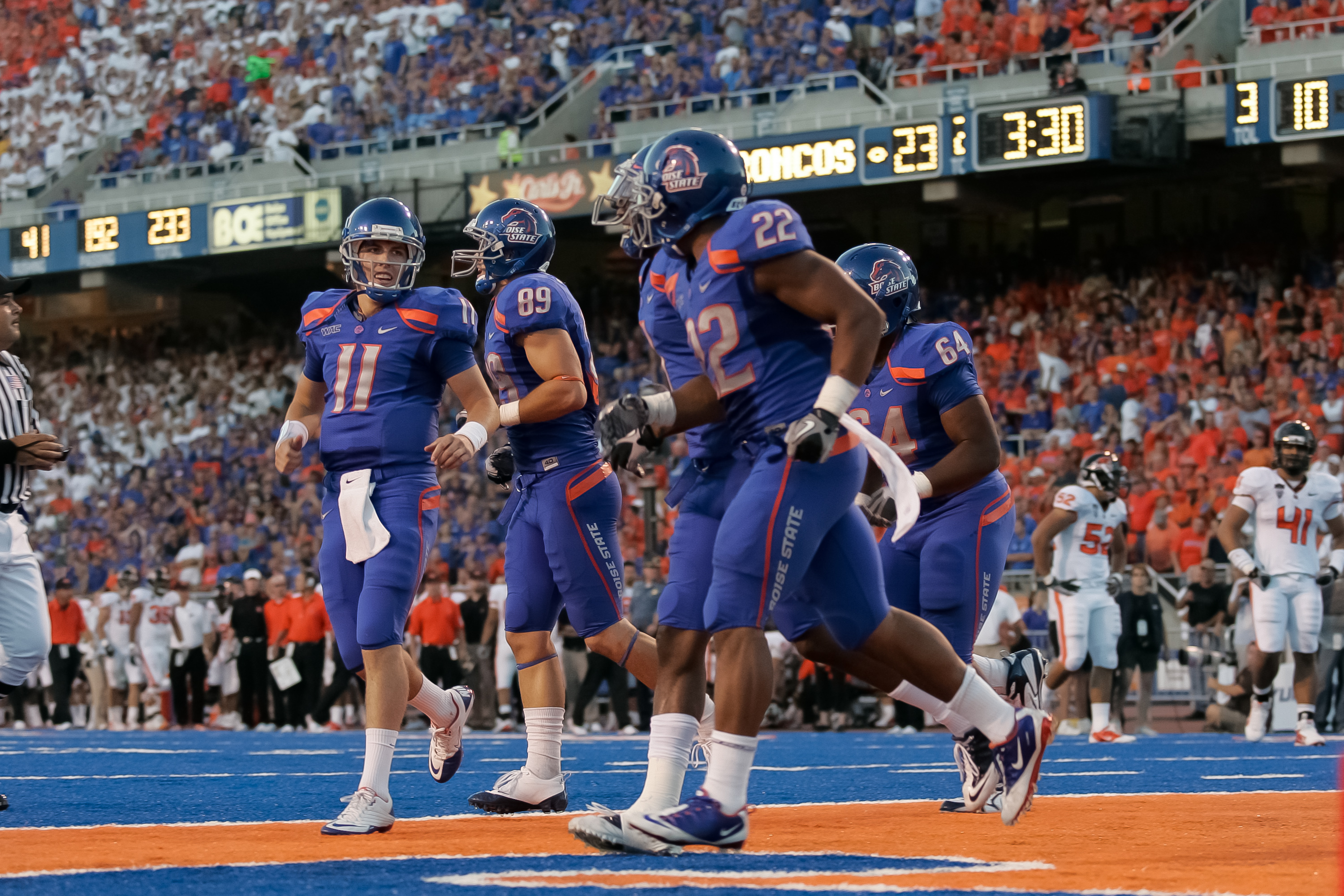 BOISE, ID - SEPTEMBER 25:  Quarterback Kellen Moore #11 and the Boise State Broncos celebrates a touchdown against the Oregon Stage Beavers at Bronco Stadium on September 25, 2010 in Boise, Idaho.  (Photo by Otto Kitsinger III/Getty Images)