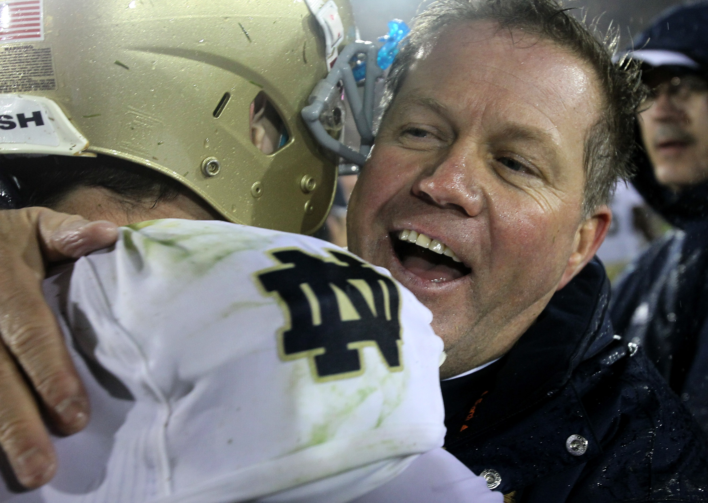 LOS ANGELES, CA - NOVEMBER 27:  Head coach Brian Kelly and quarterback Tommy Rees #13 of the Notre Dame Fighting Irish embrace after the game against the USC Trojans at the Los Angeles Memorial Coliseum on November 27, 2010 in Los Angeles, California.  No
