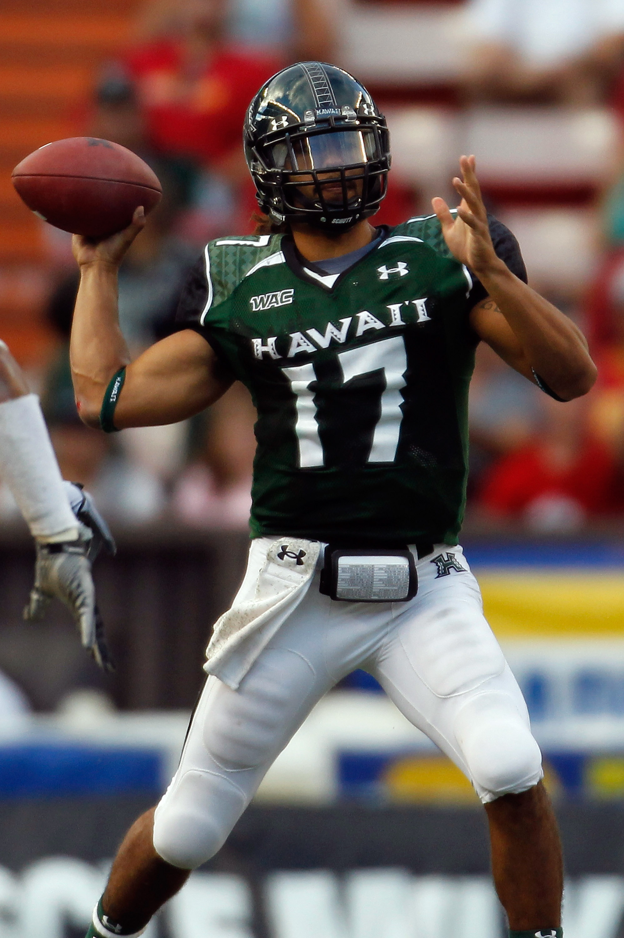 HONOLULU - SEPTEMBER 2:  Quarterback Bryant Moniz #17 of the University of Hawaii Warriors makes a pass against the University of Southern California Trojans during first half action at Aloha Stadium September 2, 2010 in Honolulu, Hawaii. (Photo by Kent N