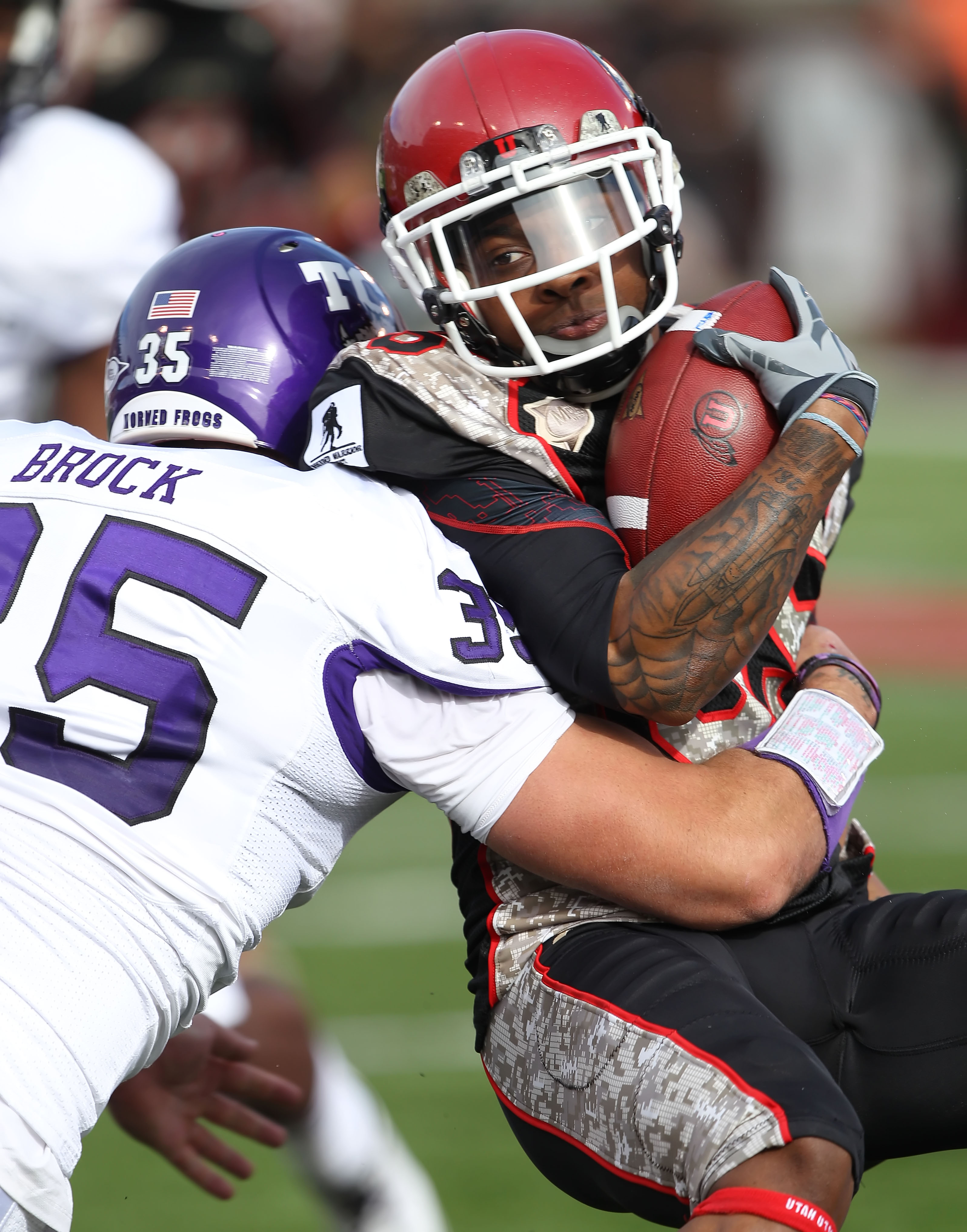 SALT LAKE CITY, UT - NOVEMBER 6: Jereme Brooks #85 of the Utah Utes is hit by Tanner Brock #35 of the TCU Horned Frogs during the first half of an NCAA football game November 6, 2010 at Rice-Eccles Stadium in Salt Lake City, Utah. (Photo by George Frey/Ge