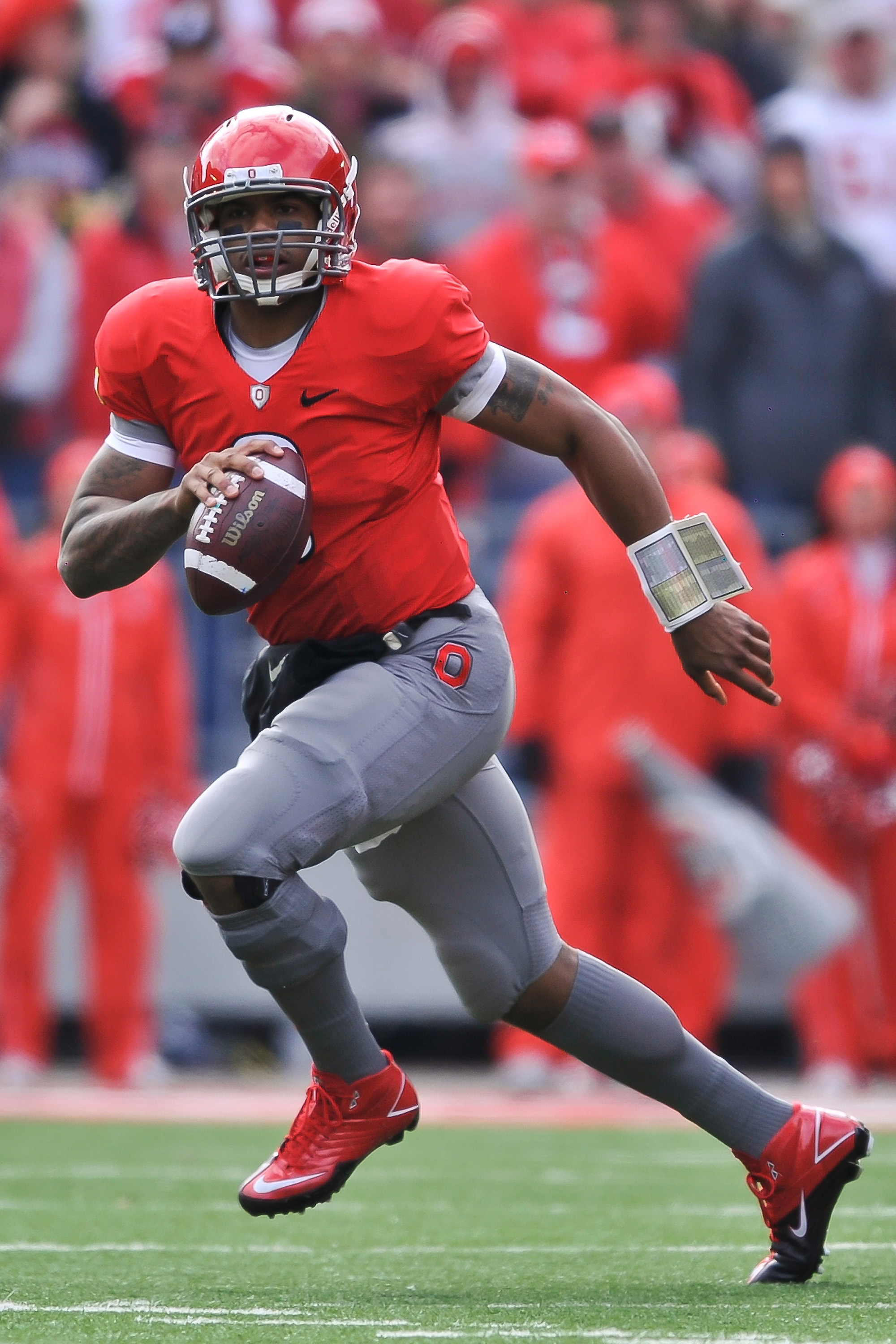 COLUMBUS, OH - NOVEMBER 27:  Quarterback Terrelle Pryor #2 of the Ohio State Buckeyes rolls out of the pocket against the Michigan Wolverines at Ohio Stadium on November 27, 2010 in Columbus, Ohio.  (Photo by Jamie Sabau/Getty Images)