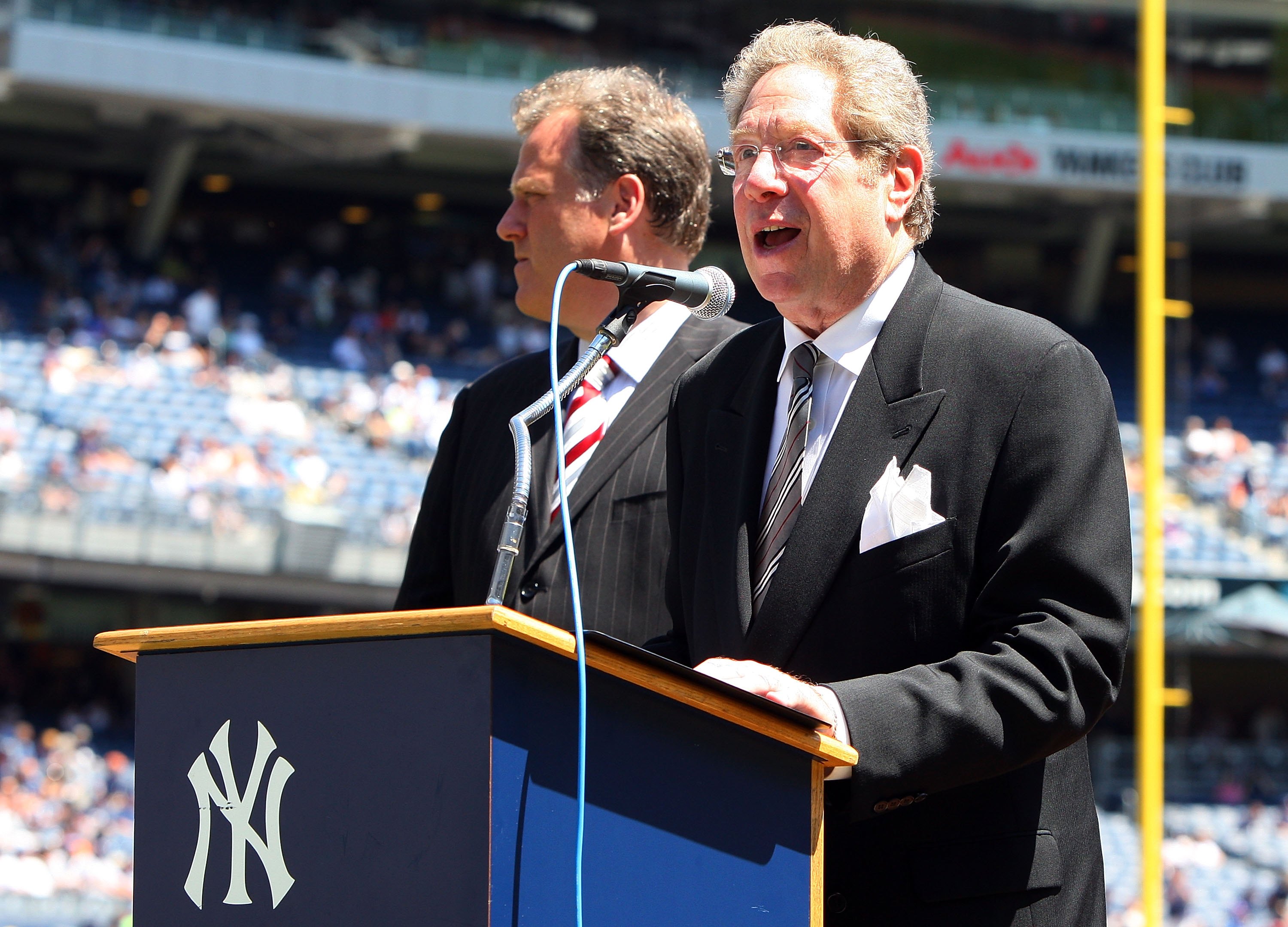 NEW YORK - JULY 19:  New York Yankees radio broadcaster John Sterling speaks during the teams 63rd Old Timers Day before the game against the Detroit Tigers on July 19, 2009 at Yankee Stadium in the Bronx borough of New York City.  (Photo by Jim McIsaac/G