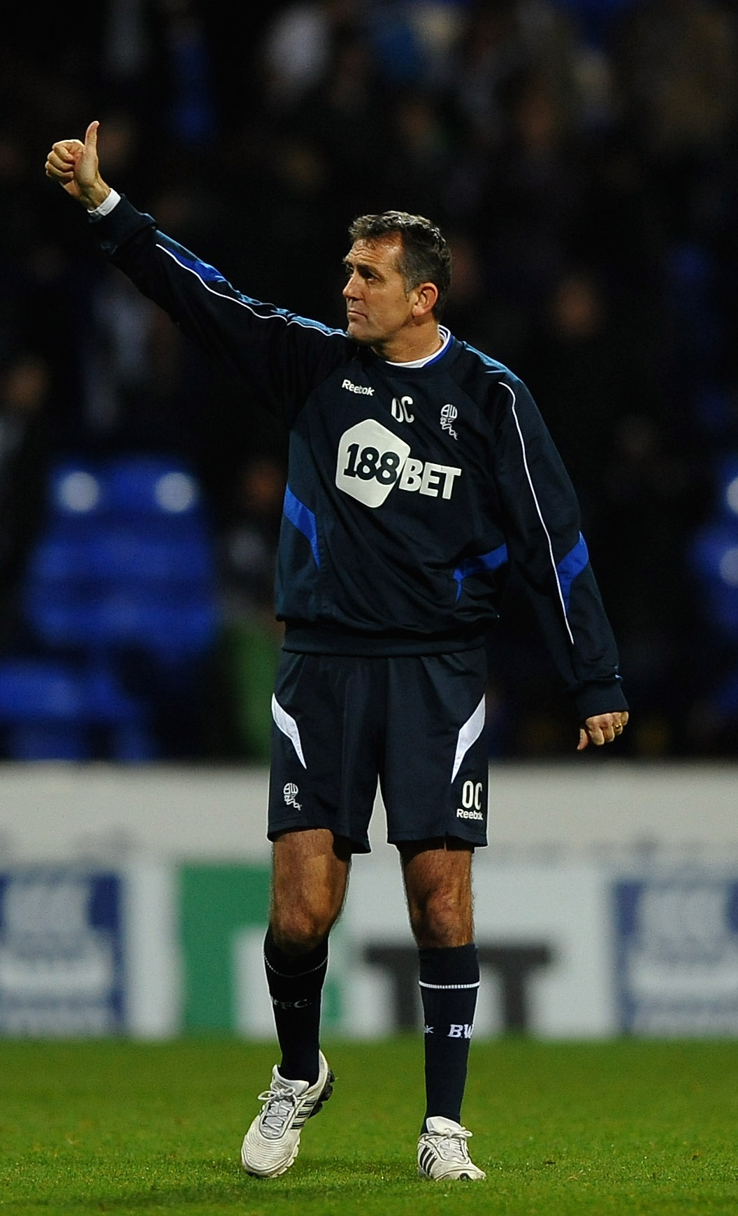 BOLTON, ENGLAND - NOVEMBER 20: Owen Coyle of Bolton Wanderers applauds the fans during the Barclays Premier League match between Bolton Wanderers and Newcastle United at the Reebok Stadium on November 20, 2010 in Bolton, England.  (Photo by Laurence Griff