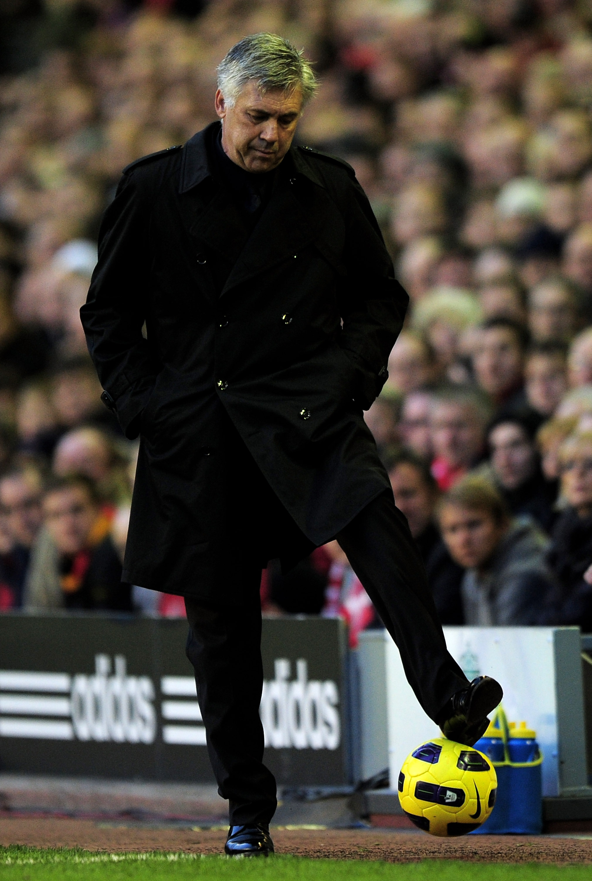 LIVERPOOL, ENGLAND - NOVEMBER 07:   Chelsea Manager Carlo Ancelotti controls the ball during the Barclays Premier League match between Liverpool and Chelsea at Anfield on November 7, 2010 in Liverpool, England. (Photo by Shaun Botterill/Getty Images)