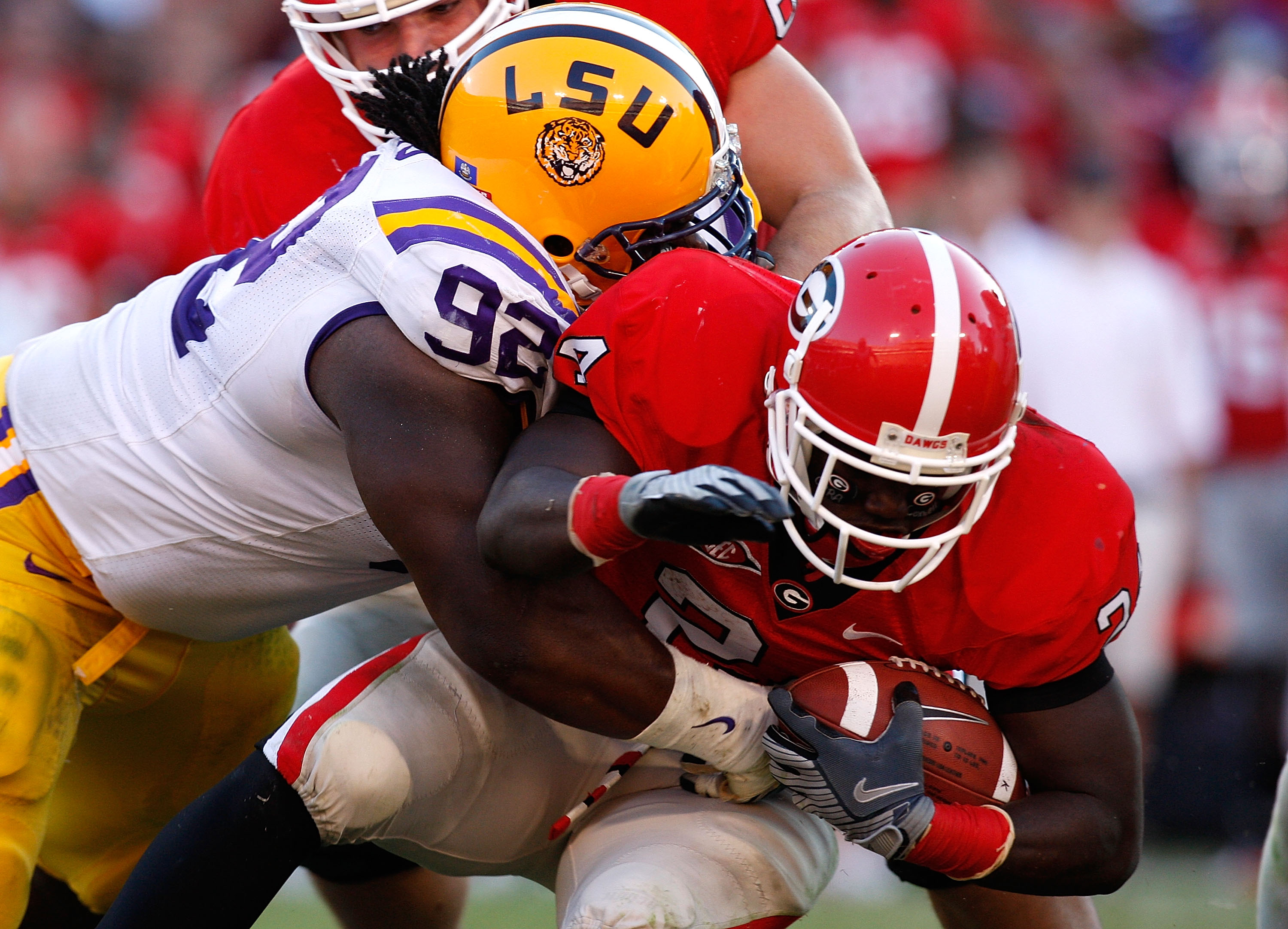 ATHENS, GA - OCTOBER 03: Drake Nevis #92 of the Louisiana State University Tigers tackles Washaun Ealey #24 of the Georgia Bulldogs at Sanford Stadium on October 3, 2009 in Athens, Georgia. (Photo by Kevin C. Cox/Getty Images)