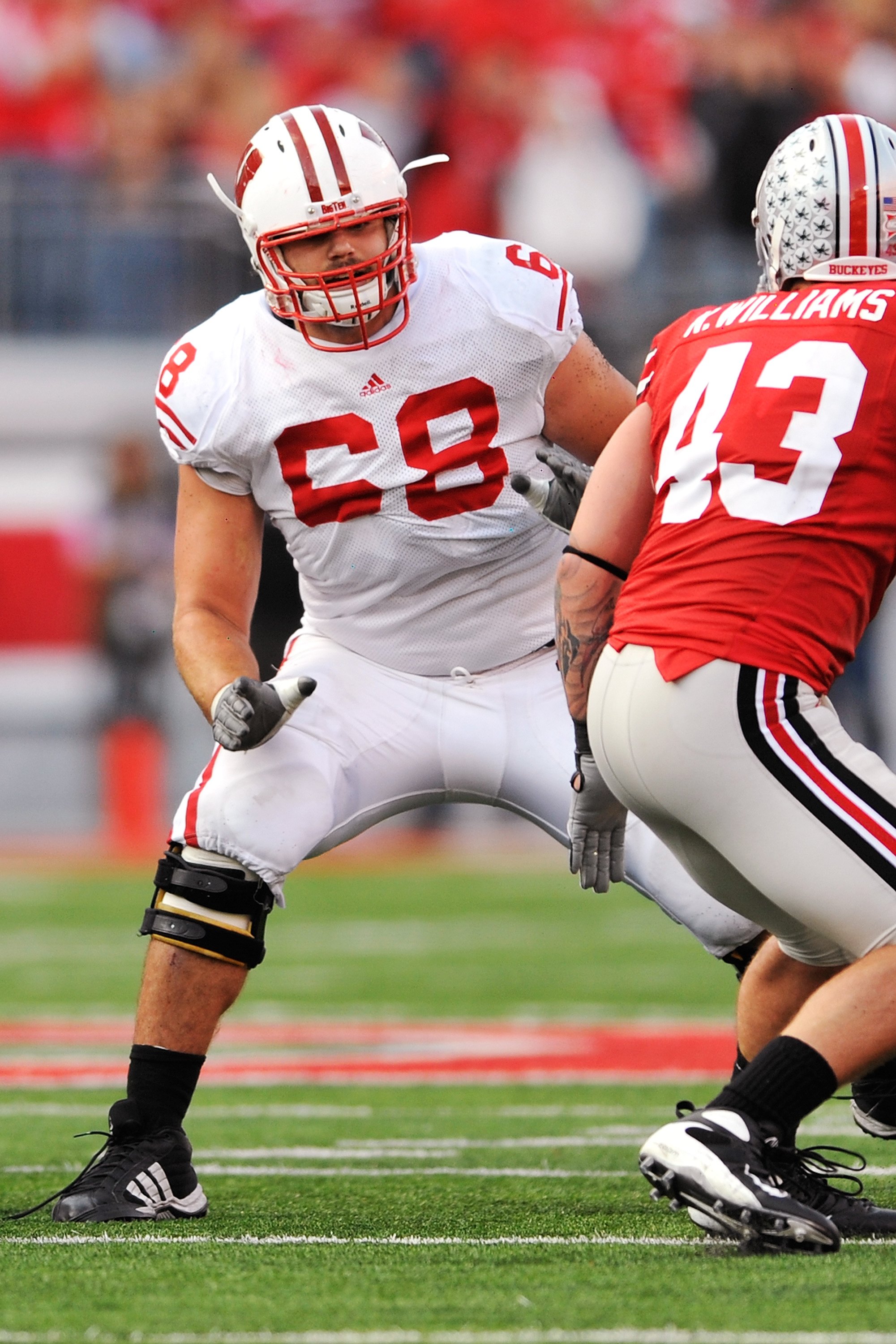 COLUMBUS, OH - OCTOBER 10:  Offensive lineman Gabe Carimi #68 of the Wisconsin Badgers blocks against the Ohio State Buckeyes at Ohio Stadium on October 10, 2009 in Columbus, Ohio.  (Photo by Jamie Sabau/Getty Images)