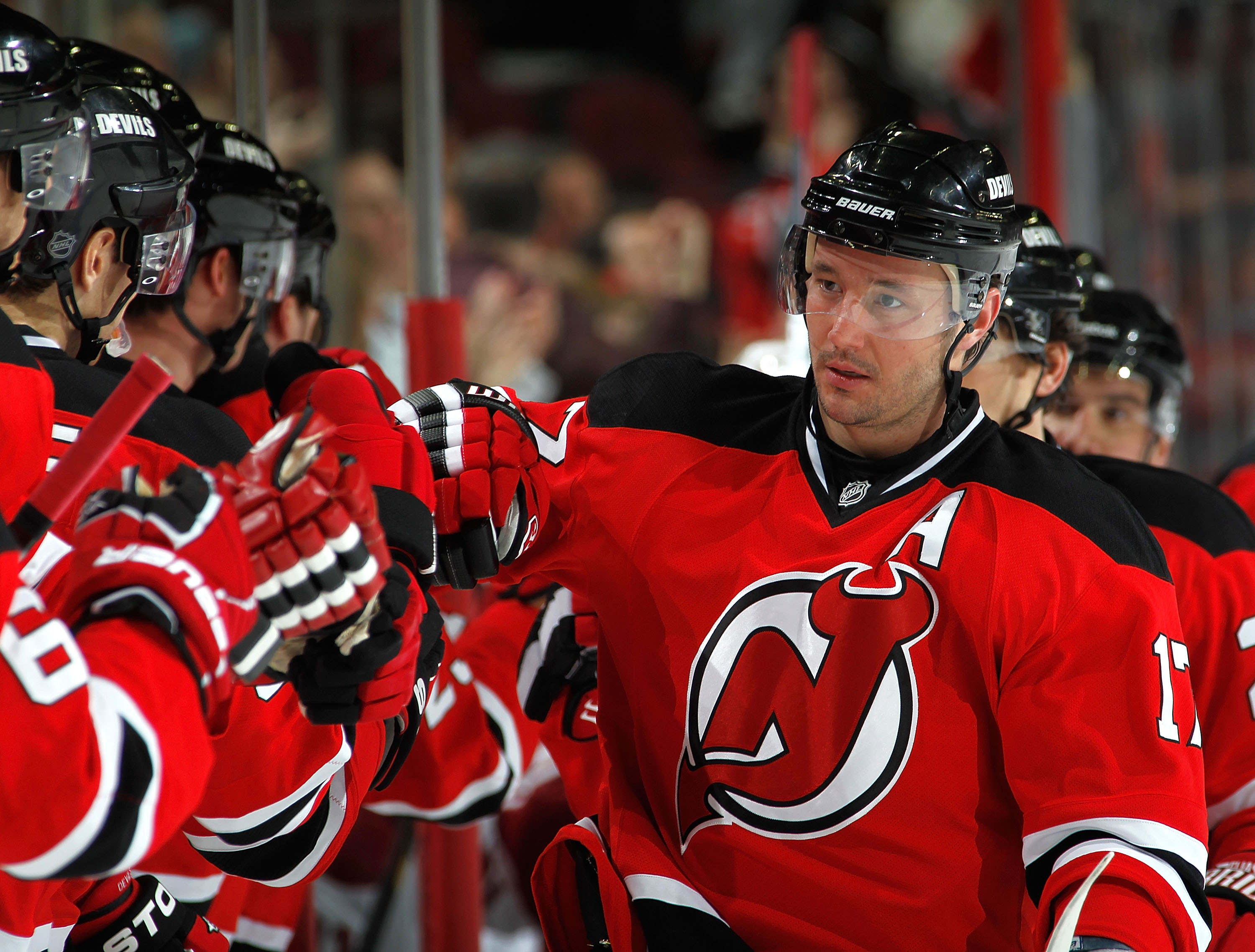 NEWARK, NJ - DECEMBER 15:  Ilya Kovalchuk #17 of the New Jersey Devils is congratulated at the Devils bench for his goal during the third period of a hockey game against the Phoenix Coyotes at the Prudential Center on December 15, 2010 in Newark, New Jers