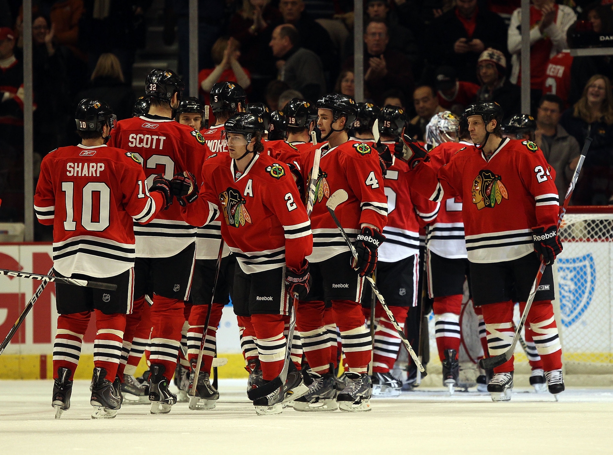 CHICAGO, IL - DECEMBER 19: Members of the Chicago Blackhawks including Patrick Sharp #10, Duncan Keith #2 and Niklas Hjalmarsson #4 celebrate a win over the Los Angeles Kings at the United Center on December 19, 2010 in Chicago, Illinois. The Blackhawks d CHICAGO, IL - DECEMBER 19: Members of the Chicago Blackhawks including Patrick Sharp #10, Duncan Keith #2 and Niklas Hjalmarsson #4 celebrate a win over the Los Angeles Kings at the United Center on December 19, 2010 in Chicago, Illinois. The Blackhawks d