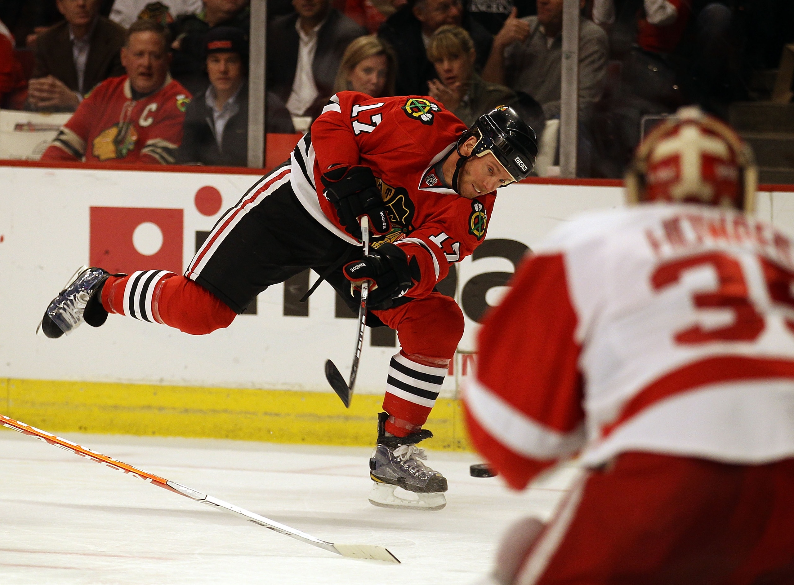 CHICAGO, IL - DECEMBER 17: Ryan Johnson #17 of the Chicago Blackhawks fires a shot at Jimmy Howard #35 of the Detroit Red Wings at the United Center on December 17, 2010 in Chicago, Illinois. (Photo by Jonathan Daniel/Getty Images) CHICAGO, IL - DECEMBER 17: Ryan Johnson #17 of the Chicago Blackhawks fires a shot at Jimmy Howard #35 of the Detroit Red Wings at the United Center on December 17, 2010 in Chicago, Illinois. (Photo by Jonathan Daniel/Getty Images)
