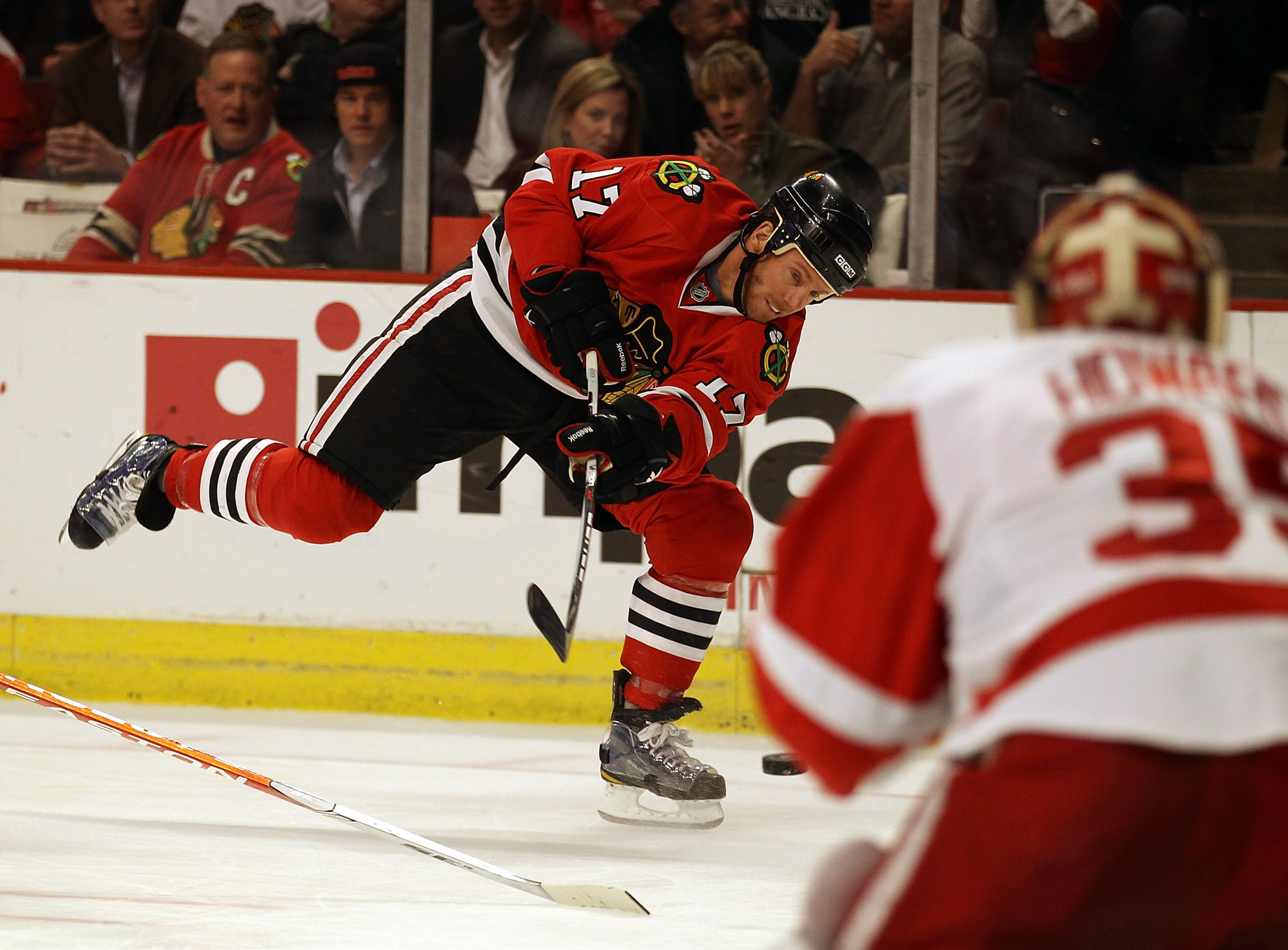 CHICAGO, IL - DECEMBER 17: Ryan Johnson #17 of the Chicago Blackhawks fires a shot at Jimmy Howard #35 of the Detroit Red Wings at the United Center on December 17, 2010 in Chicago, Illinois. (Photo by Jonathan Daniel/Getty Images)