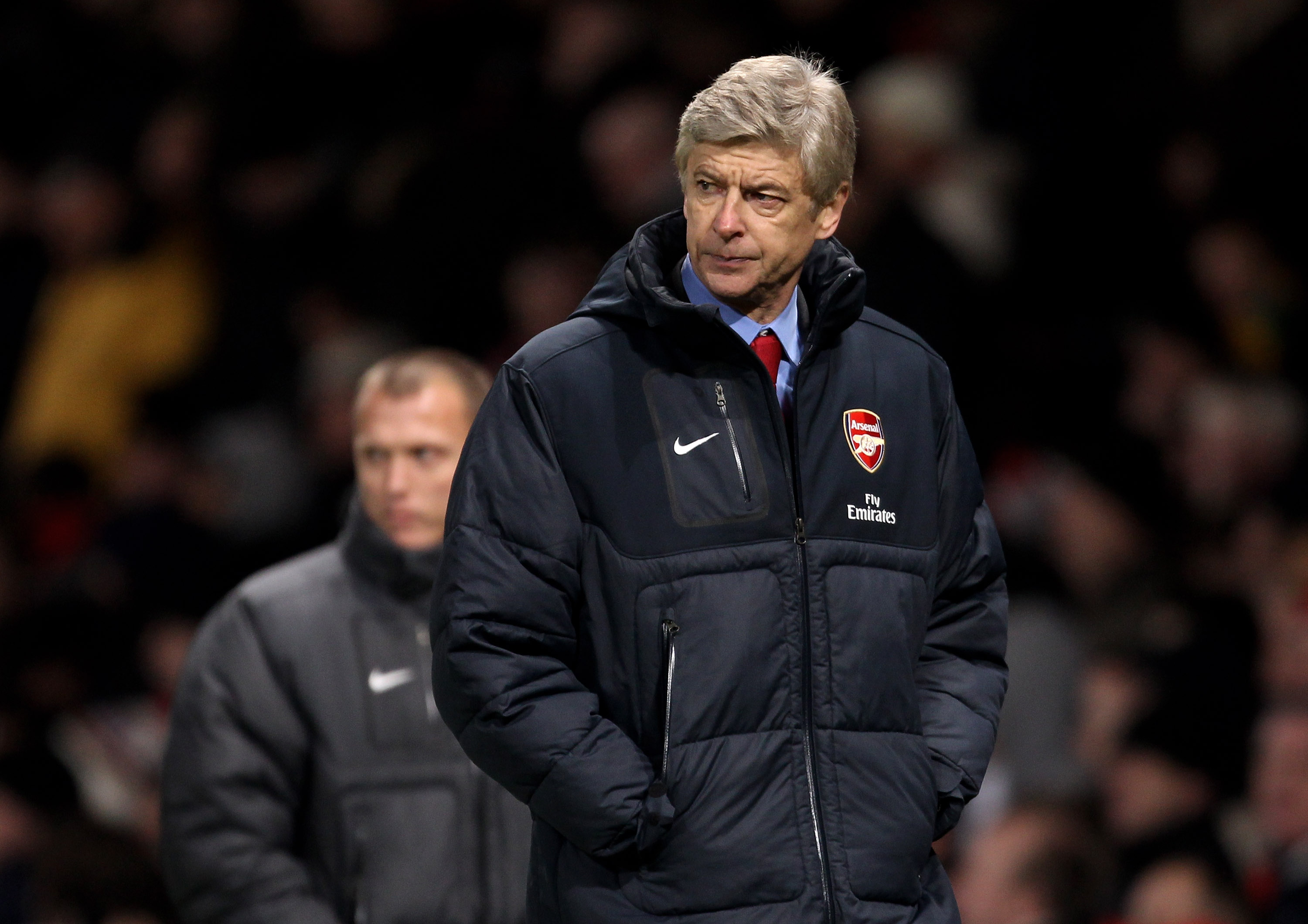 MANCHESTER, ENGLAND - DECEMBER 13:  Arsenal Manager Arsene Wenger heads for the dressing room at half time during the Barclays Premier League match between Manchester United and Arsenal at Old Trafford on December 13, 2010 in Manchester, England.  (Photo