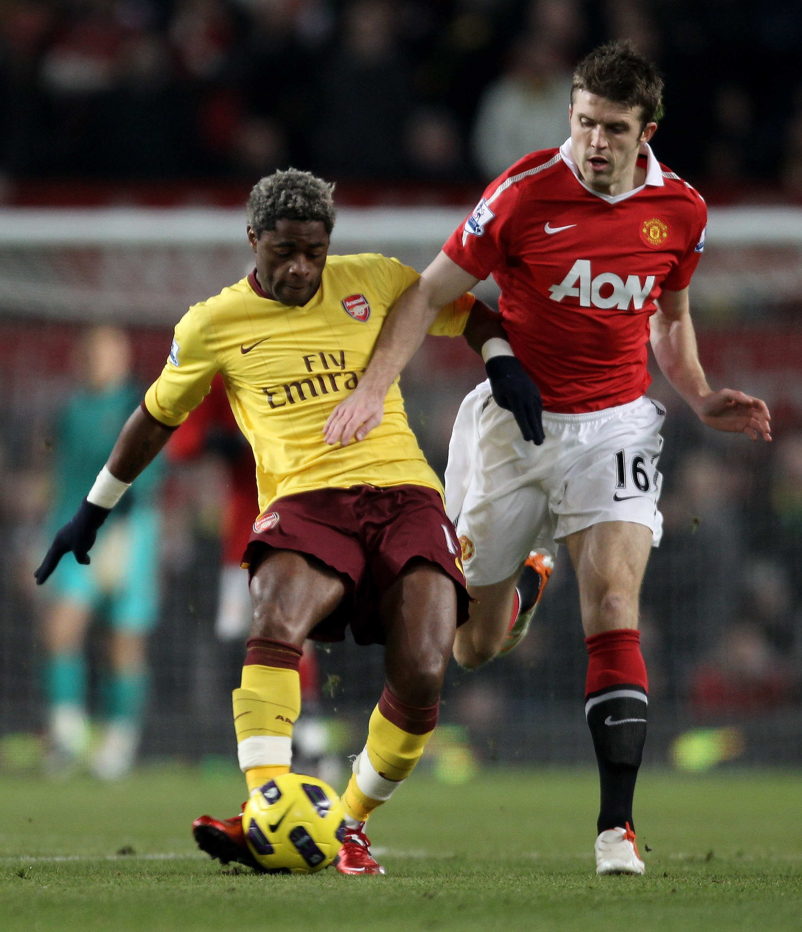 MANCHESTER, UNITED KINGDOM - DECEMBER 13:  Alexandre Song of Arsenal competes with Michael Carrick of Manchester United during the Barclays Premier League match between Manchester United and Arsenal at Old Trafford on December 13, 2010 in Manchester, Engl
