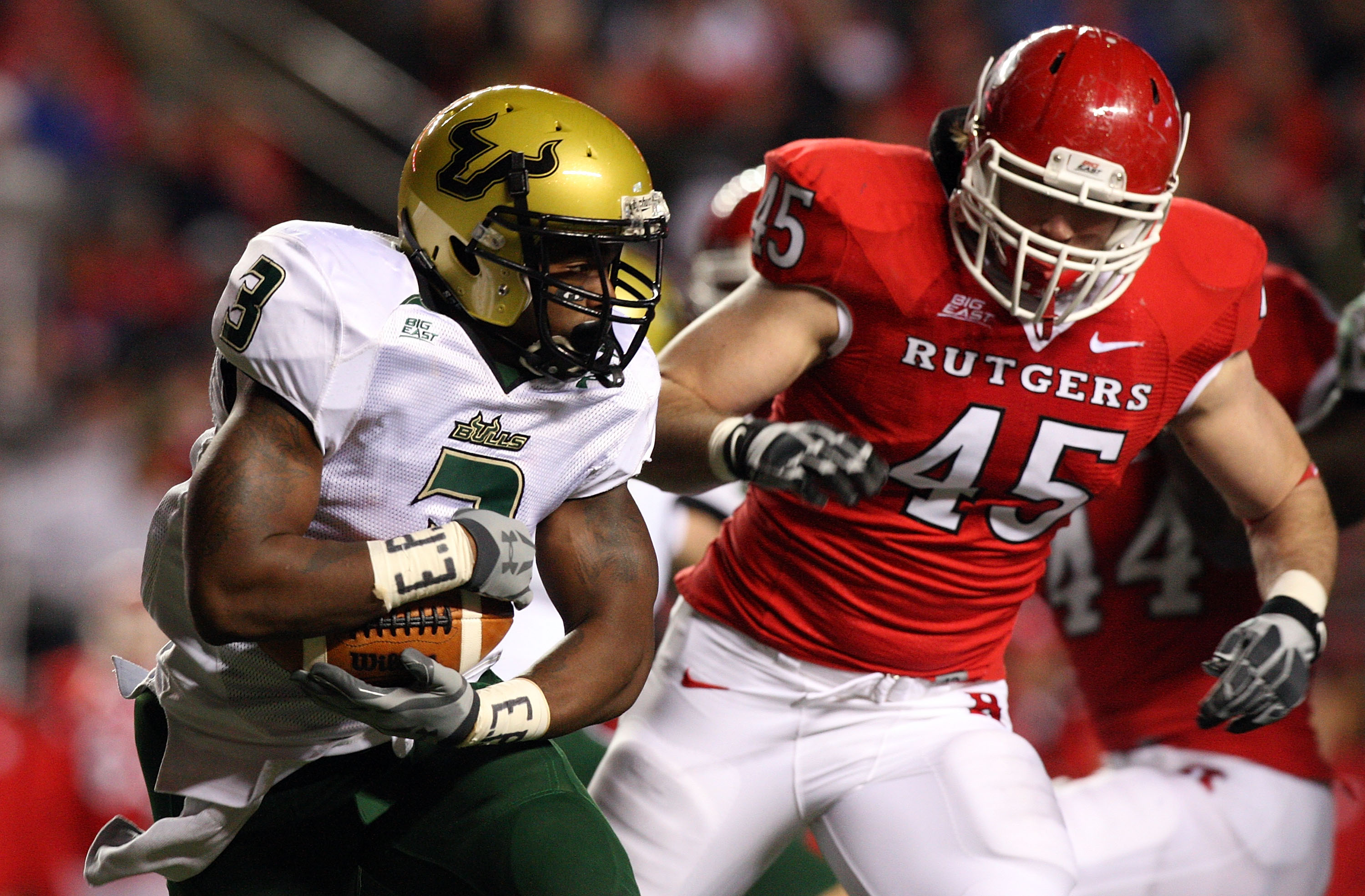 PISCATAWAY, NJ - NOVEMBER 12: Moise Plancher #3 of the South Florida Bulls runs the ball against Alex Silvestro #45 of the Rutgers Scarlet Knights at Rutgers Stadium on November 12, 2009 in Piscataway, New Jersey. (Photo by Jim McIsaac/Getty Images)