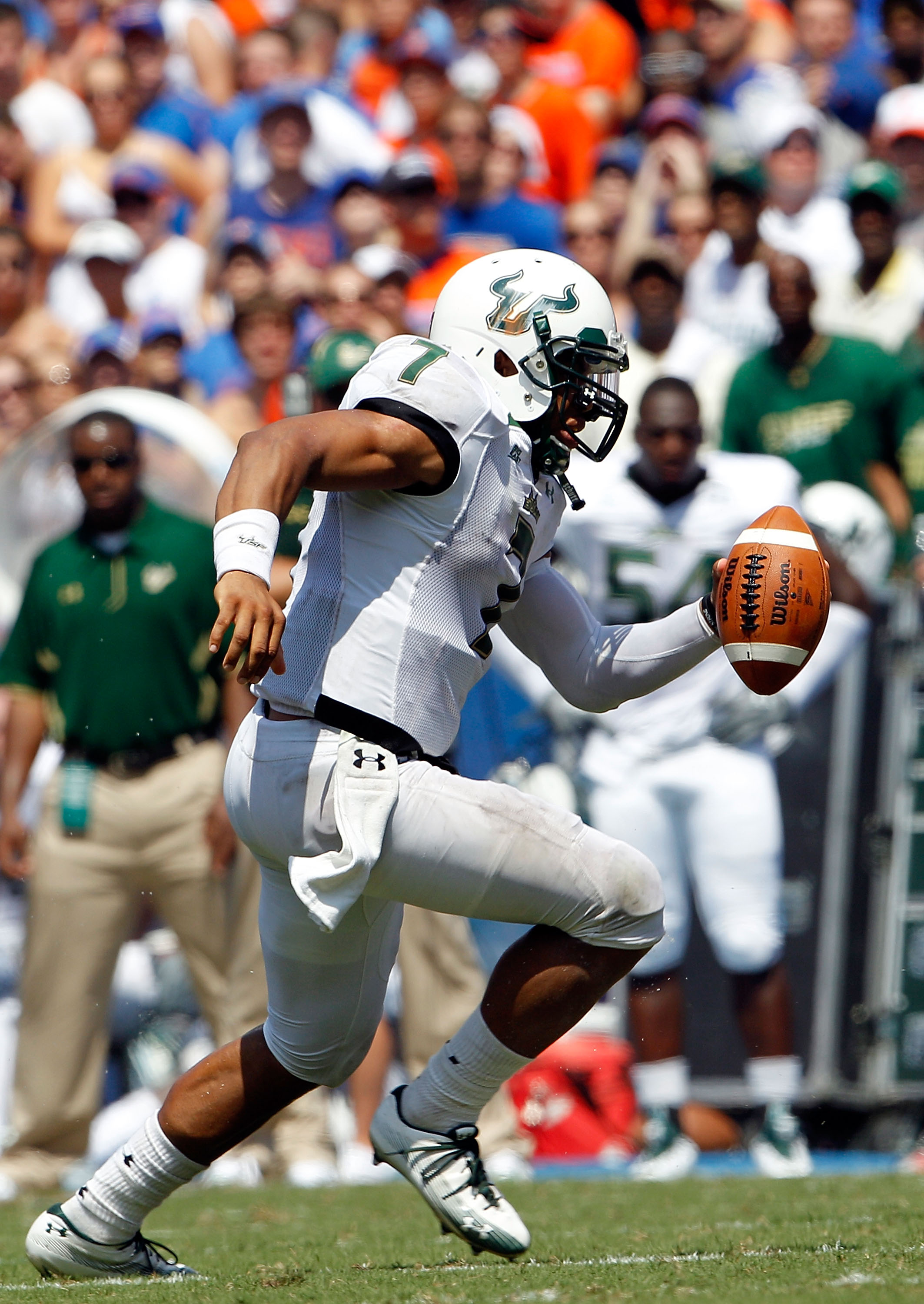 GAINESVILLE, FL - SEPTEMBER 11: Quarterback B.J. Daniels #7 of the South Florida Bulls runs for yardage during a game against the Florida Gators at Ben Hill Griffin Stadium on September 11, 2010 in Gainesville, Florida. (Photo by Sam Greenwood/Getty Ima