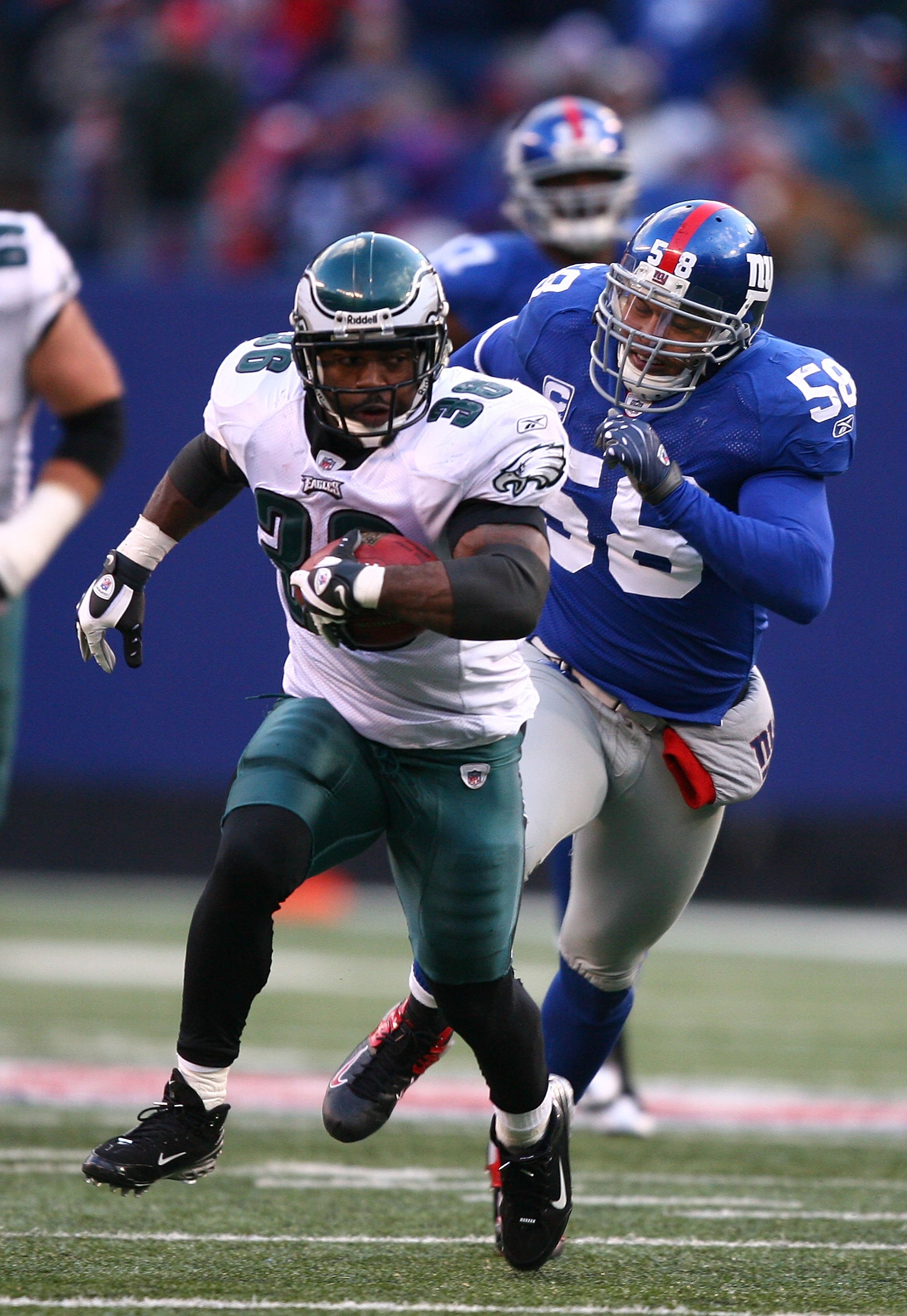 Philadelphia Eagles Brian Westbrook jumps over the pile and into the  endzone for a 1 yard touchdown late in the 2nd quarter at Giants Stadium in  East Rutherford, New Jersey on December