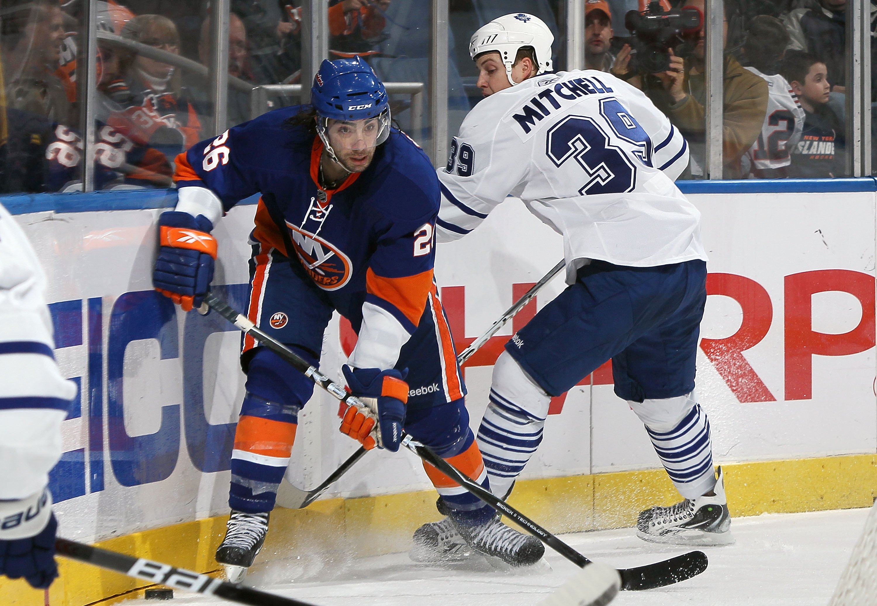 UNIONDALE, NY - MARCH 14:  Matt Moulson #26 of the New York Islanders skates against John Mitchell #39 of the Toronto Maple Leafs on March 14, 2010 at Nassau Coliseum in Uniondale, New York. The Isles defeated the Leafs 4-1.  (Photo by Jim McIsaac/Getty I