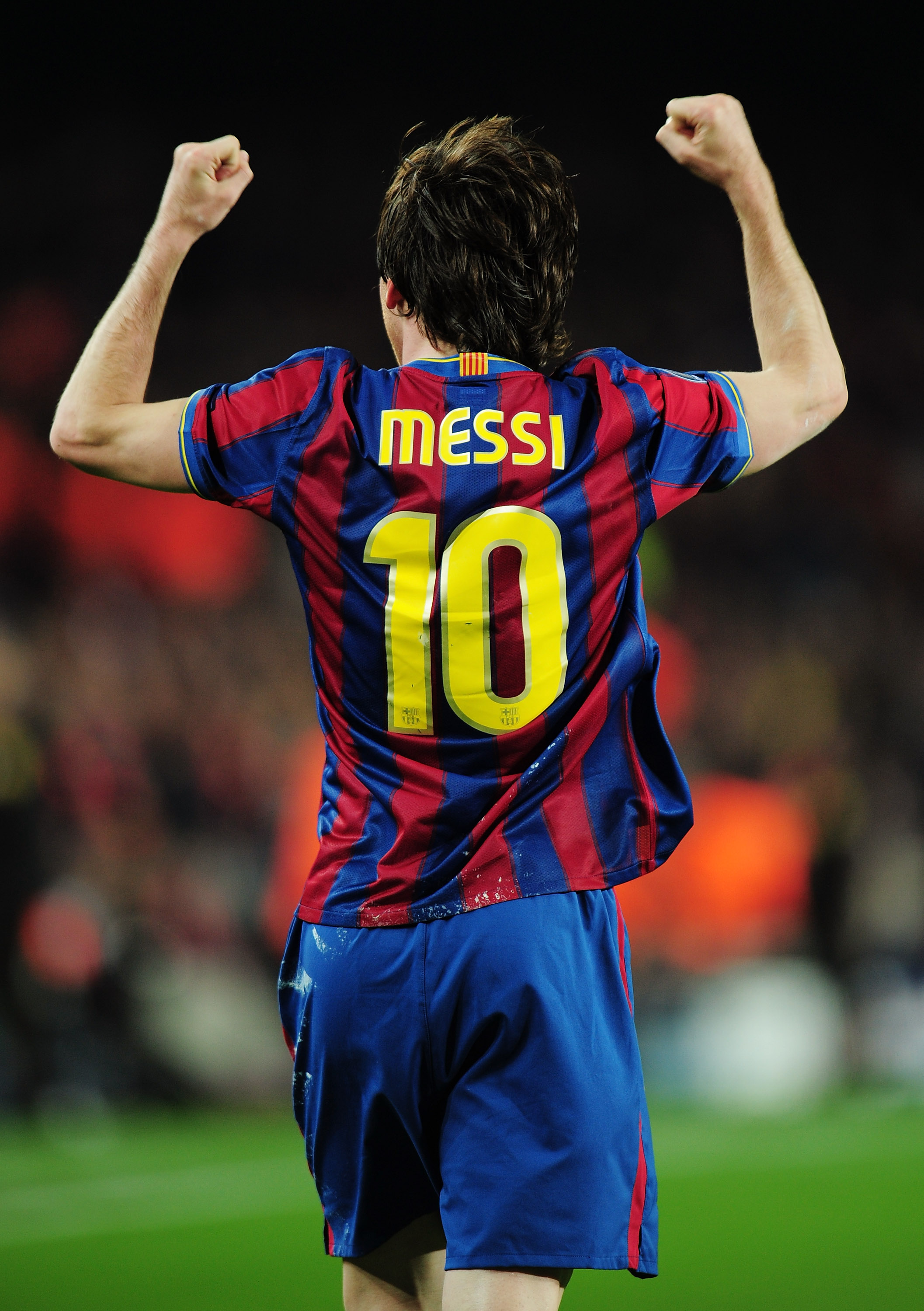 BARCELONA, SPAIN - APRIL 06:  Lionel Messi of Barcelona celebrates scoring his second goal during the UEFA Champions League quarter final second leg match between Barcelona and Arsenal at Camp Nou on April 6, 2010 in Barcelona, Spain.  (Photo by Shaun Bot