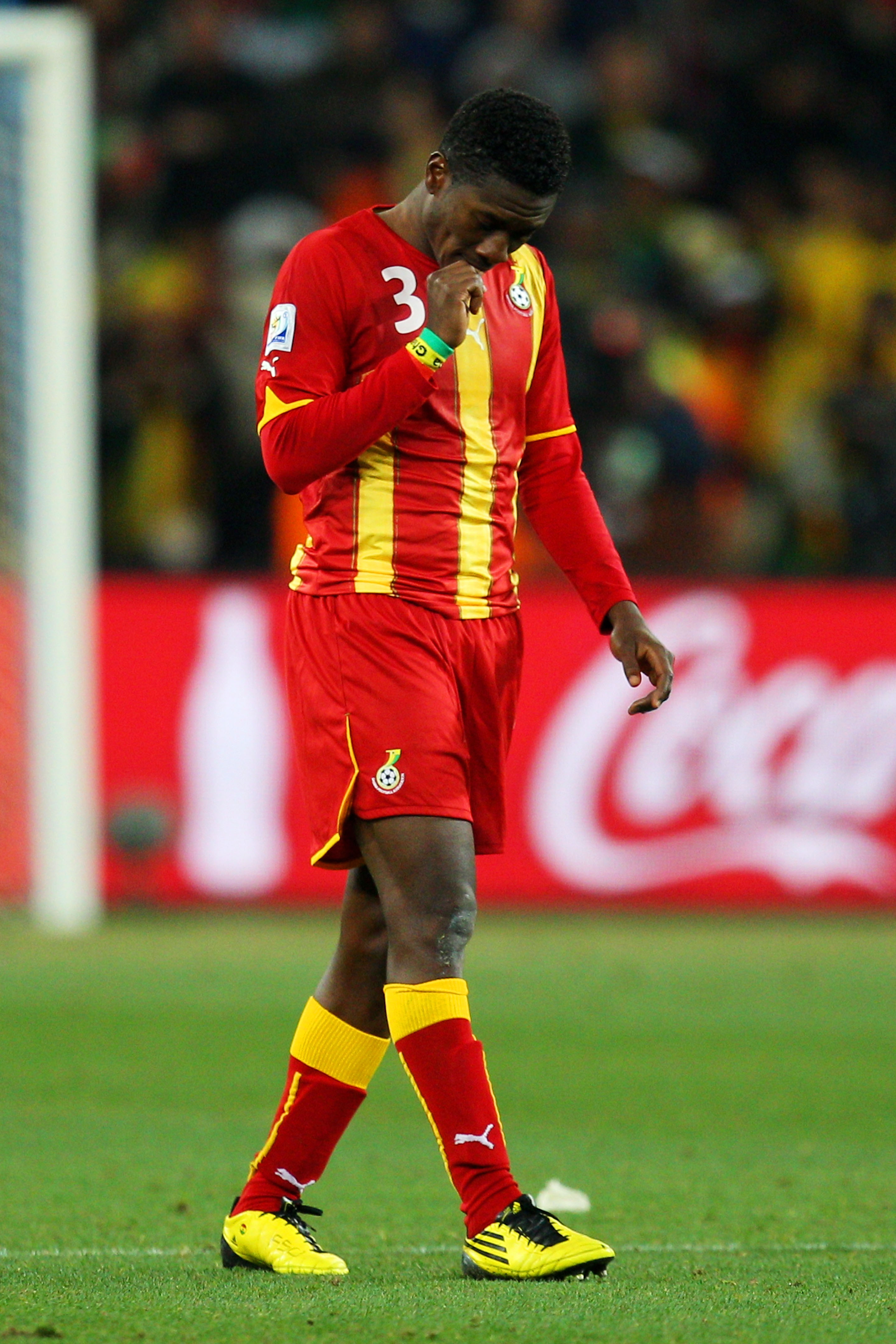JOHANNESBURG, SOUTH AFRICA - JULY 02: Asamoah Gyan of Ghana looks dejected after the 2010 FIFA World Cup South Africa Quarter Final match between Uruguay and Ghana at the Soccer City stadium on July 2, 2010 in Johannesburg, South Africa.  (Photo by Camero