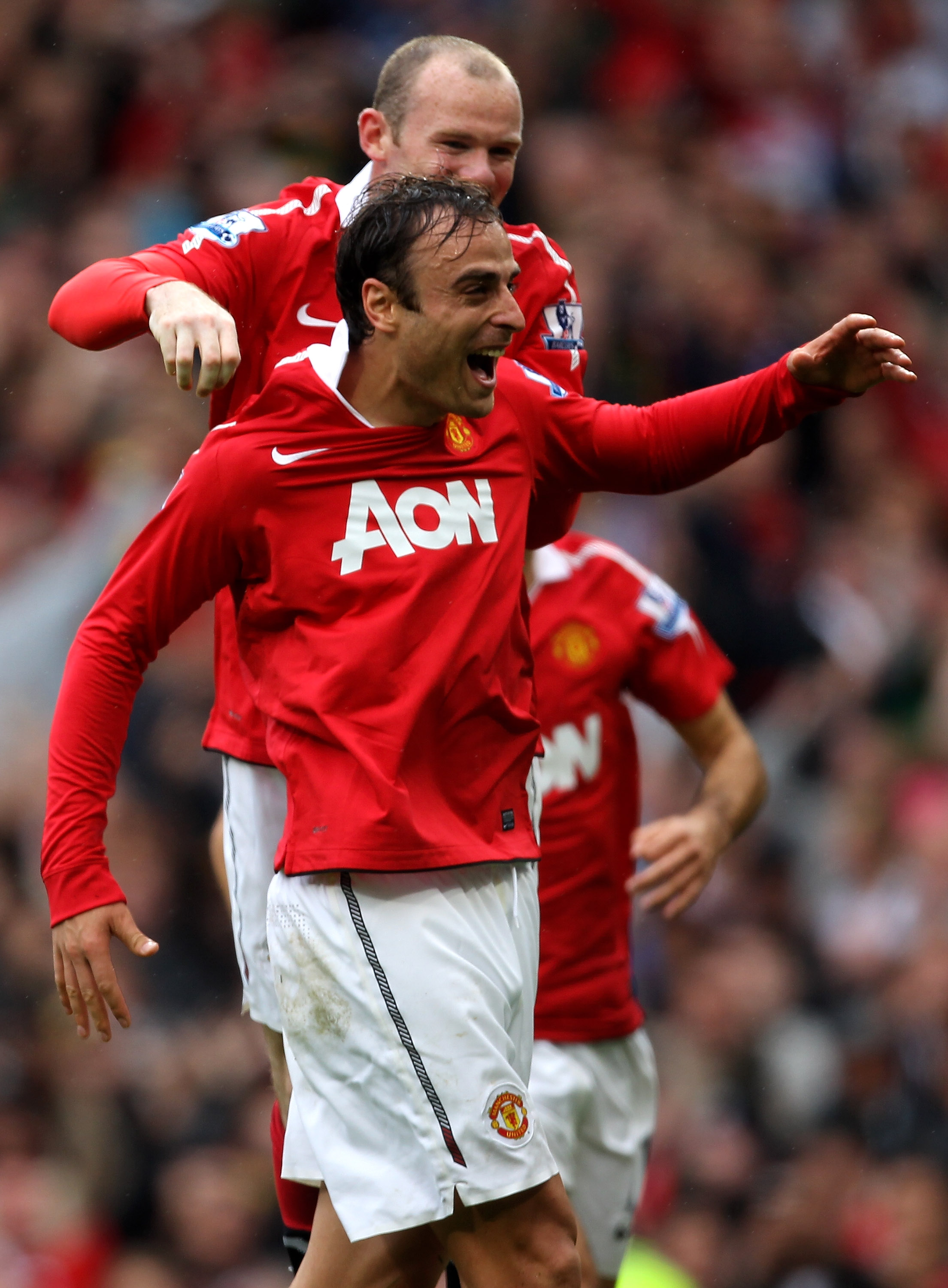 MANCHESTER, ENGLAND - SEPTEMBER 19:  Dimitar Berbatov of Manchester United celebrates scoring his team's second goal with team mate Wayne Rooney during the Barclays Premier League match between Manchester United and Liverpool at Old Trafford on September
