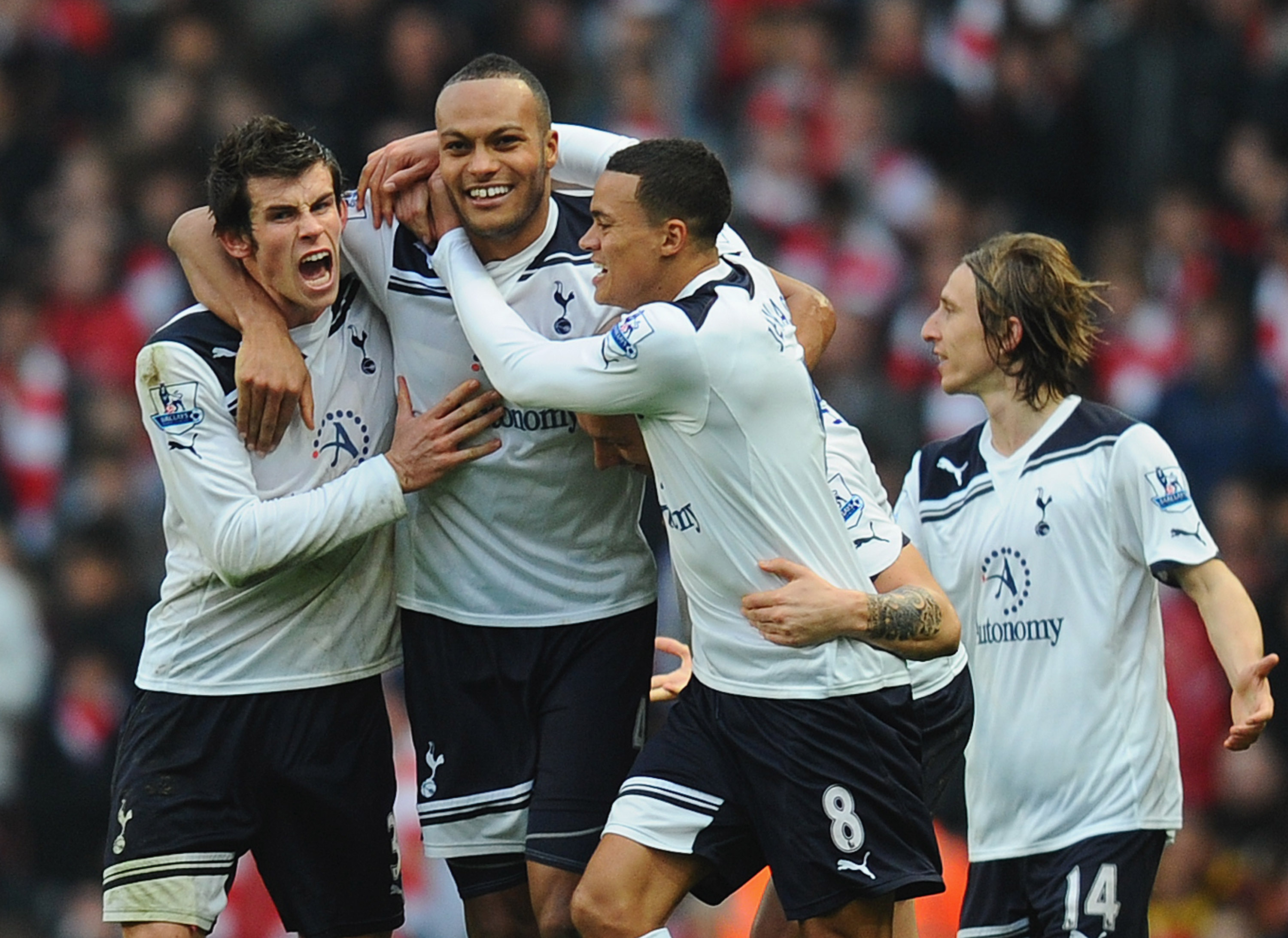 LONDON, ENGLAND - NOVEMBER 20:  Younes Kaboul of Tottenham celebrates with team mates Gareth Bale and Jermaine Jenas after scoring the winner during the Barclays Premier League match between Arsenal and Tottenham Hotspur at the Emirates Stadium on Novembe