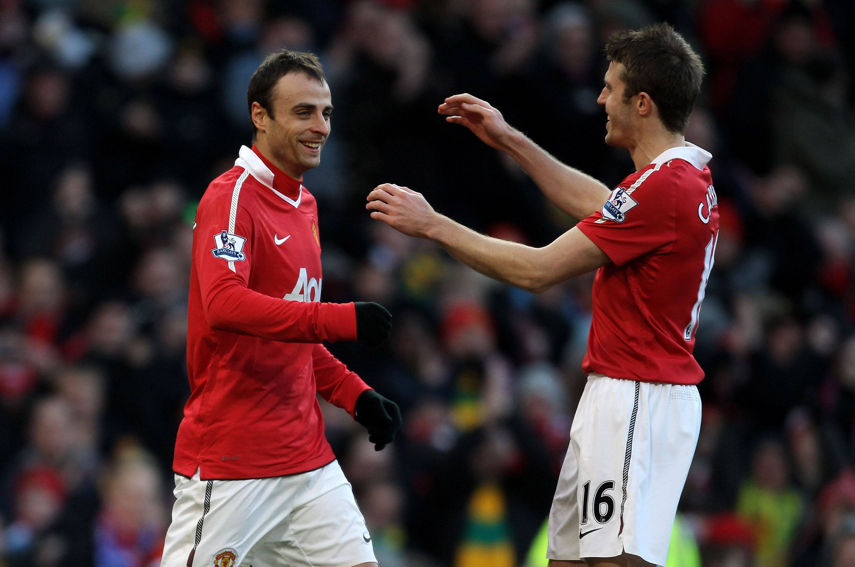 MANCHESTER, ENGLAND - NOVEMBER 27:  Dimitar Berbatov (L) of Manchester United is congratulated by team mate Michael Carrick after scoring the opening goal during the Barclays Premier League match between Manchester United and Blackburn Rovers at Old Traff