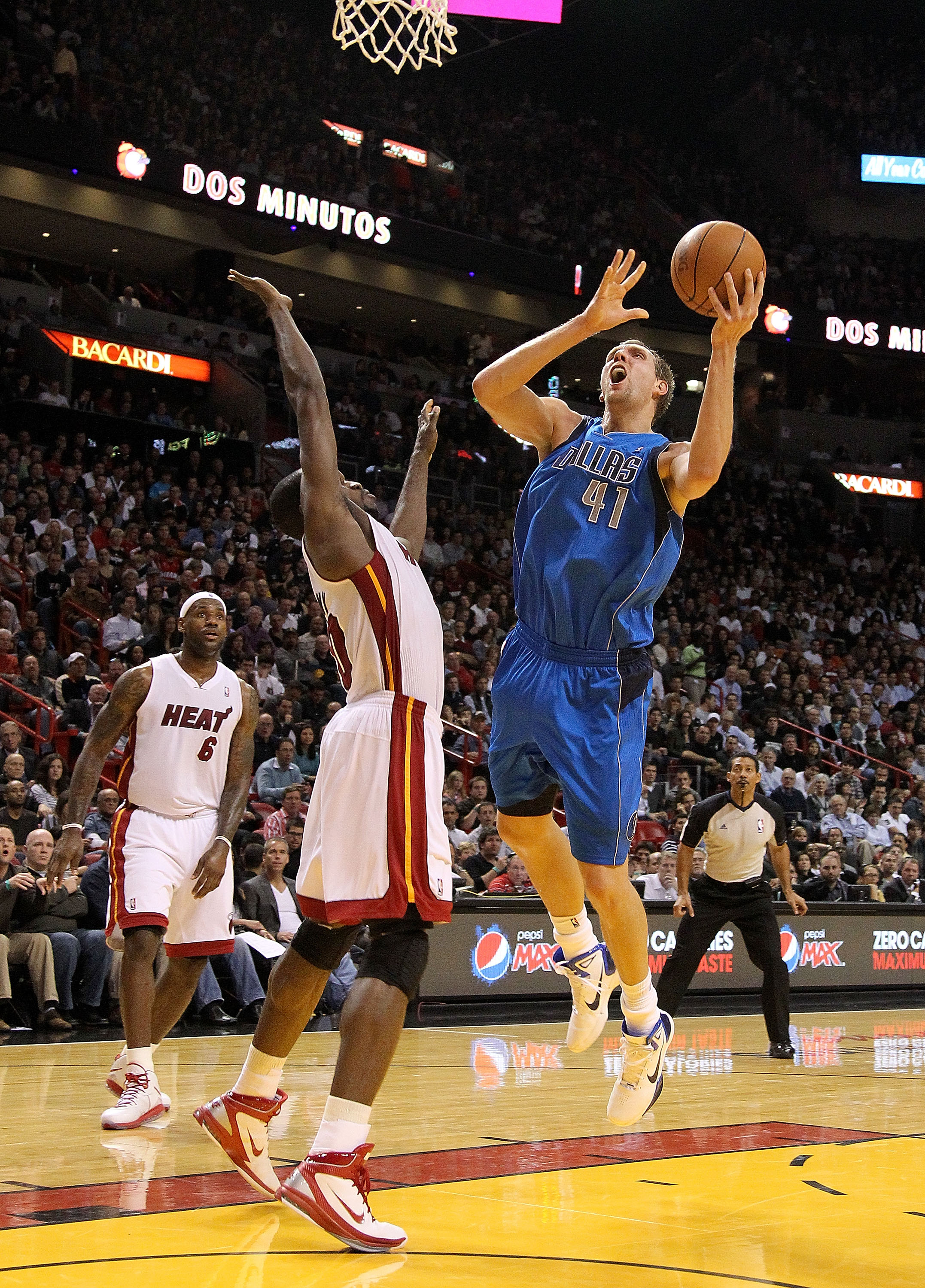 MIAMI, FL - DECEMBER 20:  Dirk Nowitzki #41 of the Dallas Mavericks shoots over Joel Anthony #50 of the Miami Heat during a game at American Airlines Arena on December 20, 2010 in Miami, Florida. NOTE TO USER: User expressly acknowledges and agrees that,
