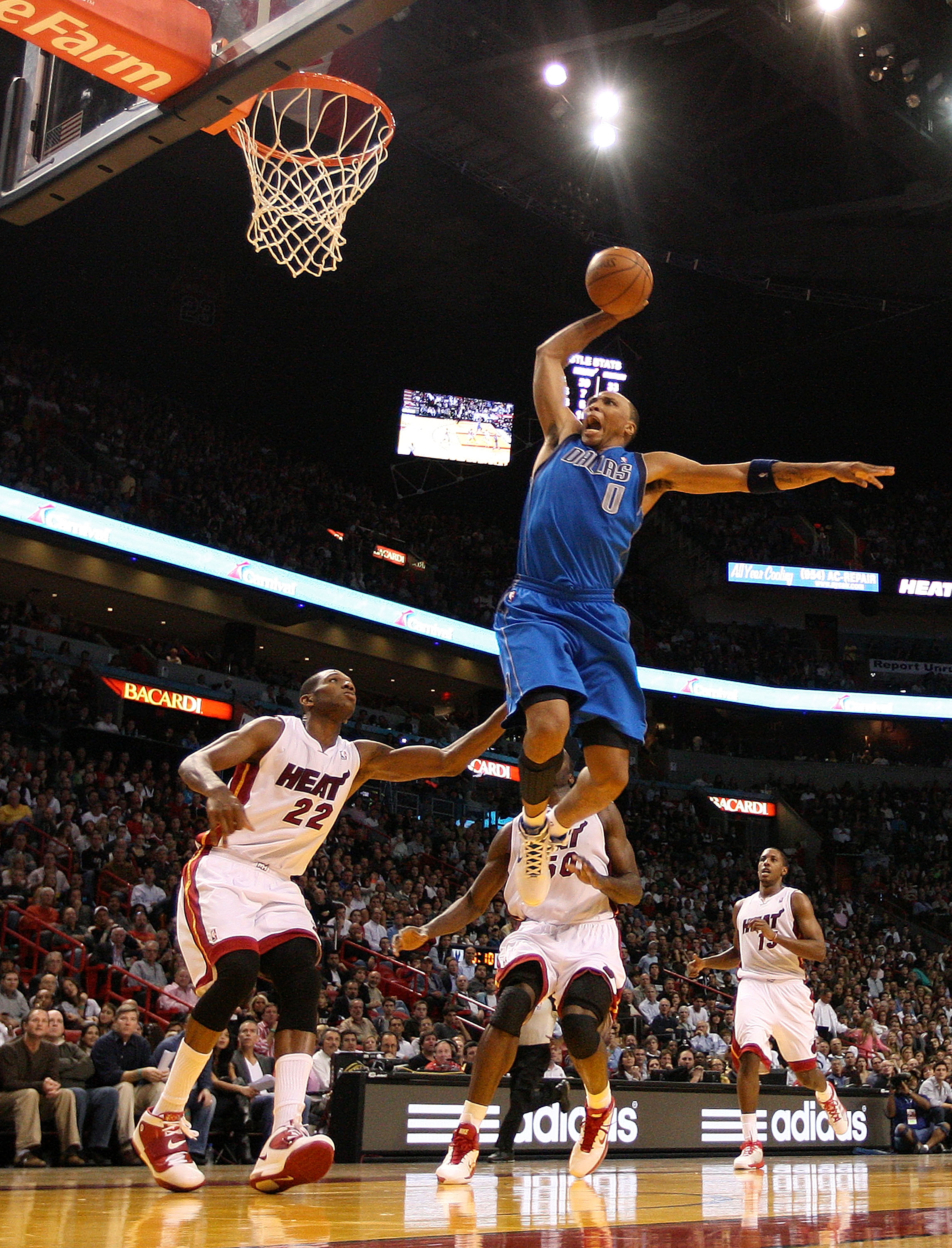 MIAMI, FL - DECEMBER 20:  Shawn Marion #0 of the Dallas Mavericks dunks over James Jones #22 of the Miami Heat during a game at American Airlines Arena on December 20, 2010 in Miami, Florida. NOTE TO USER: User expressly acknowledges and agrees that, by d