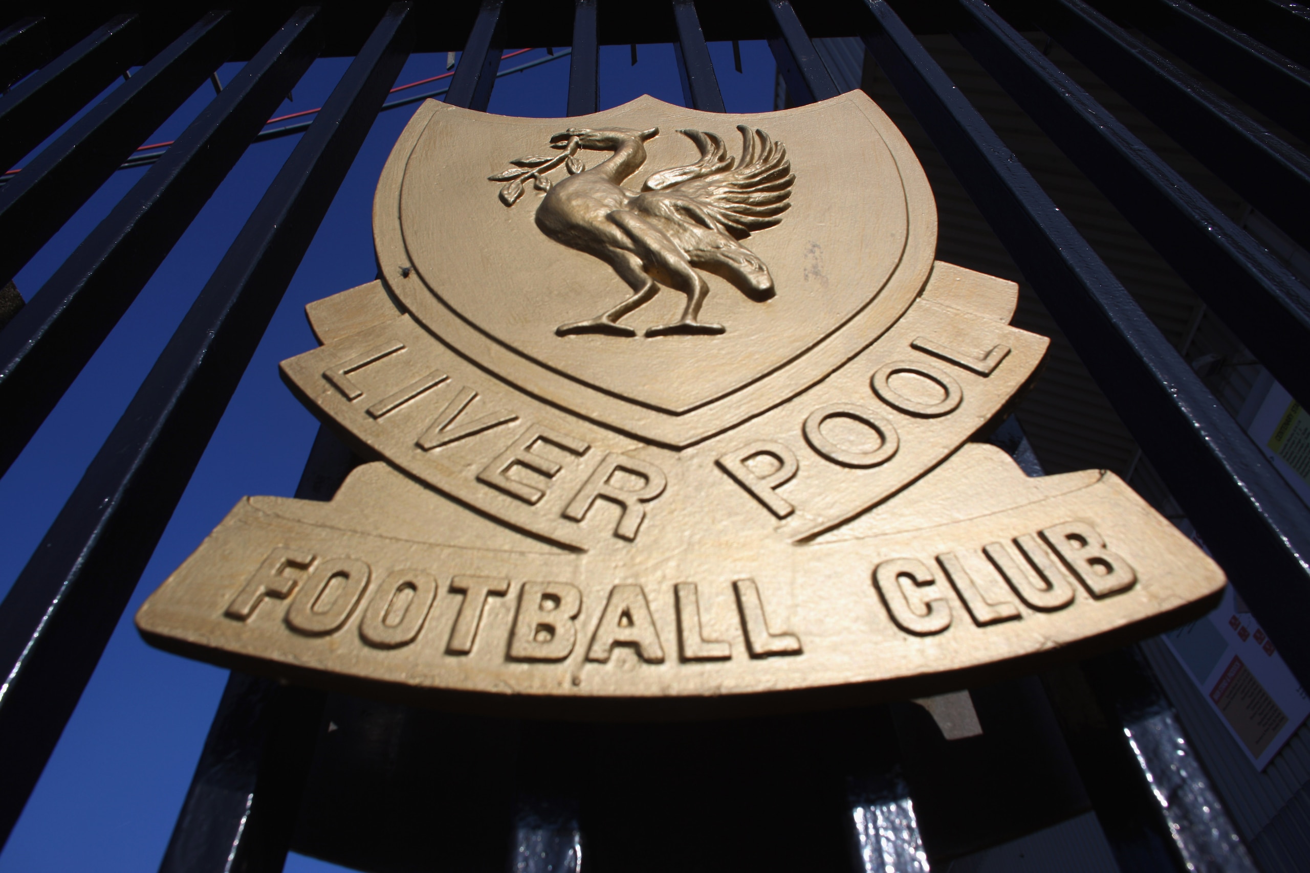 LIVERPOOL, ENGLAND - OCTOBER 12: The Liverpool Football Club emblem, the Liver Bird, adorns the gates of Anfield on October 12, 2010 in Liverpool, England. The Royal Bank of Scotland, which holds the majority of Liverpool's debts, is seeking a high cour LIVERPOOL, ENGLAND - OCTOBER 12: The Liverpool Football Club emblem, the Liver Bird, adorns the gates of Anfield on October 12, 2010 in Liverpool, England. The Royal Bank of Scotland, which holds the majority of Liverpool's debts, is seeking a high cour