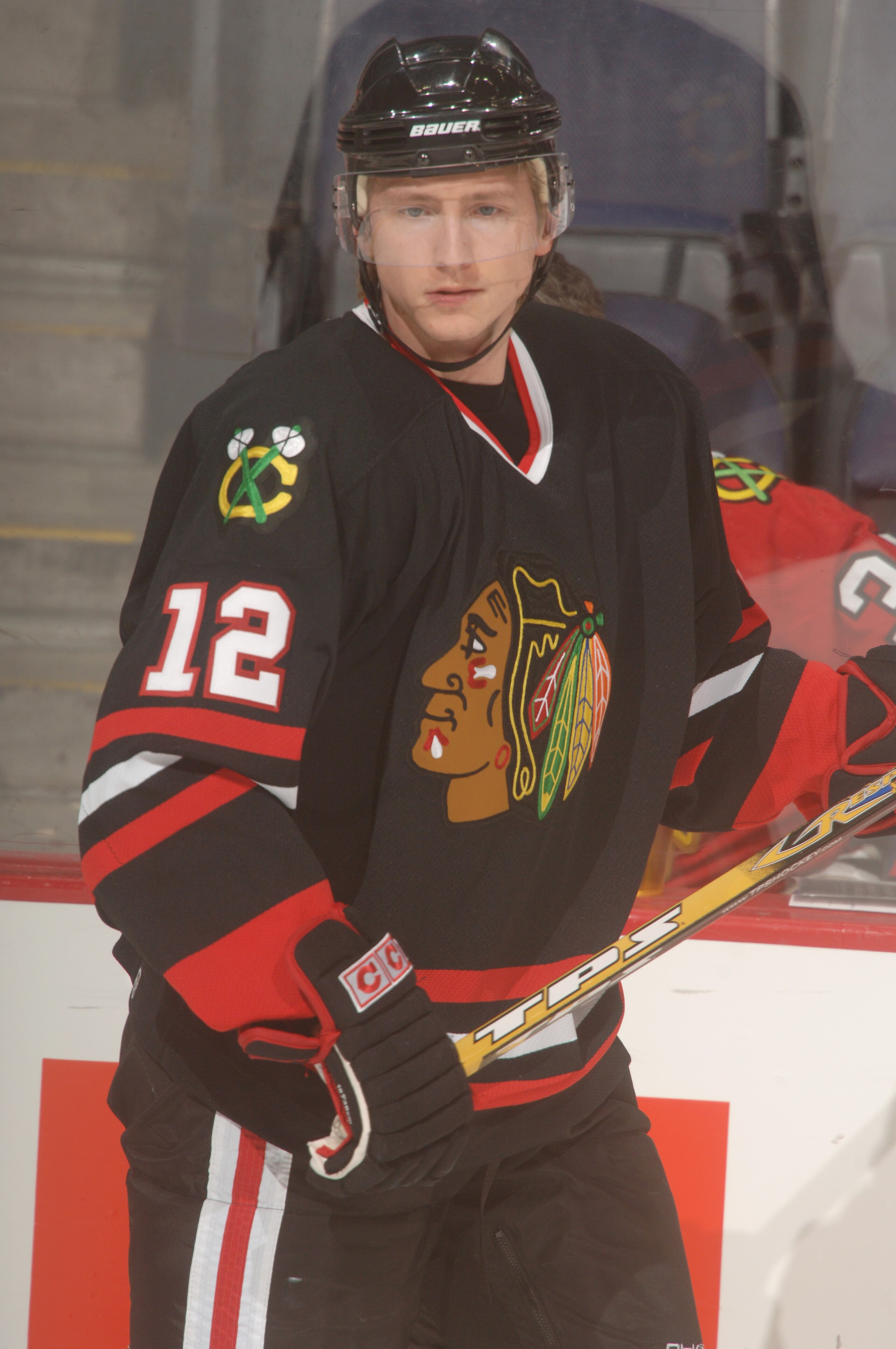 WASHINGTON - JANUARY 10:  Center Mikhail Yakubov #12 of the Chicago Blackhawks looks on during the NHL game against the Washington Capitals on January 10, 2006 at MCI Center in Washington, D.C.  The Blackhawks won 4-3.  (Mitchell Layton/Getty Images)