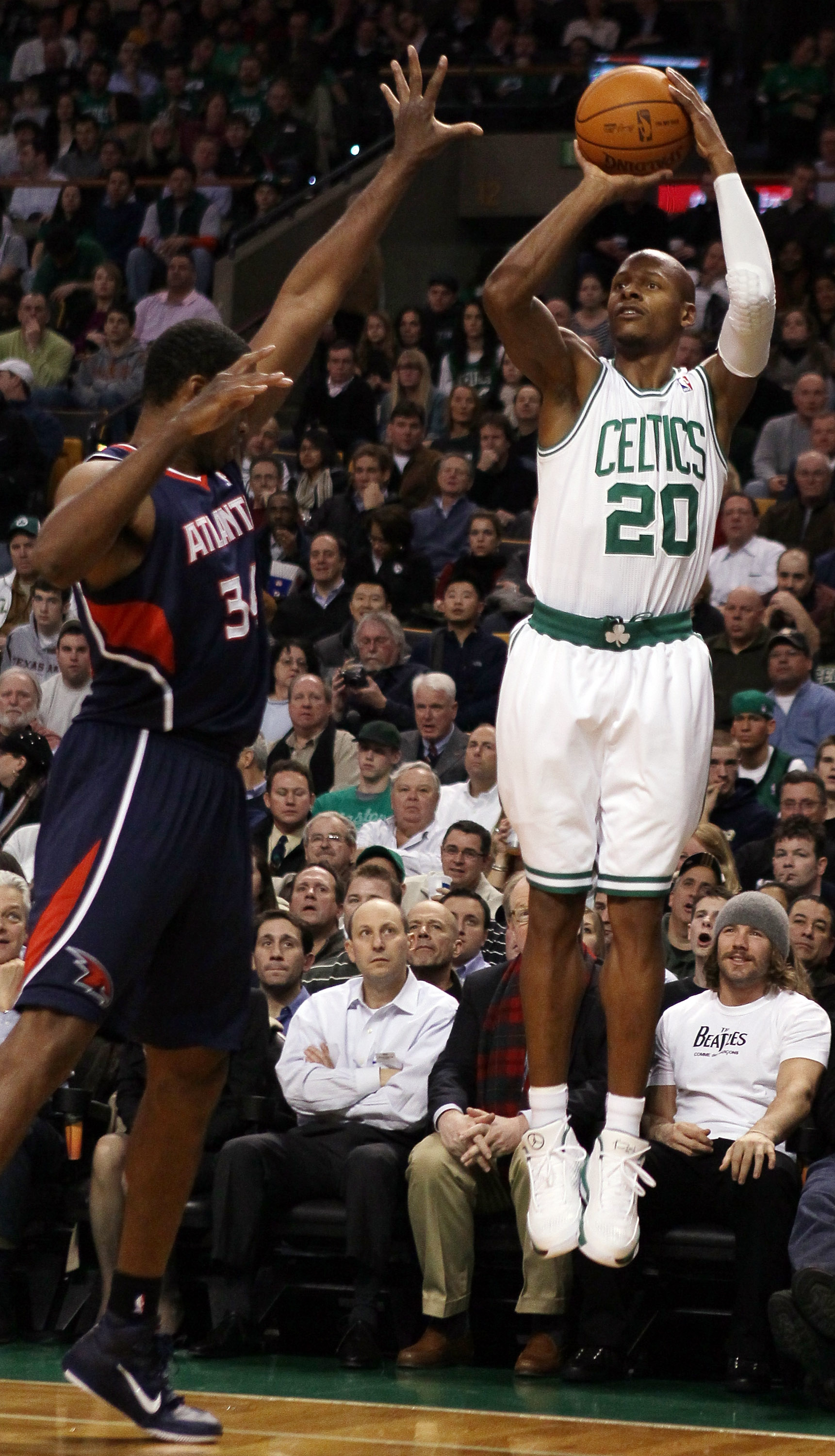 BOSTON, MA - DECEMBER 16:  Ray Allen #20 of the Boston Celtics takes a shot as Jason Collins #34 of the Atlanta Hawks on December 16, 2010 at the TD Garden in Boston, Massachusetts. NOTE TO USER: User expressly acknowledges and agrees that, by downloading