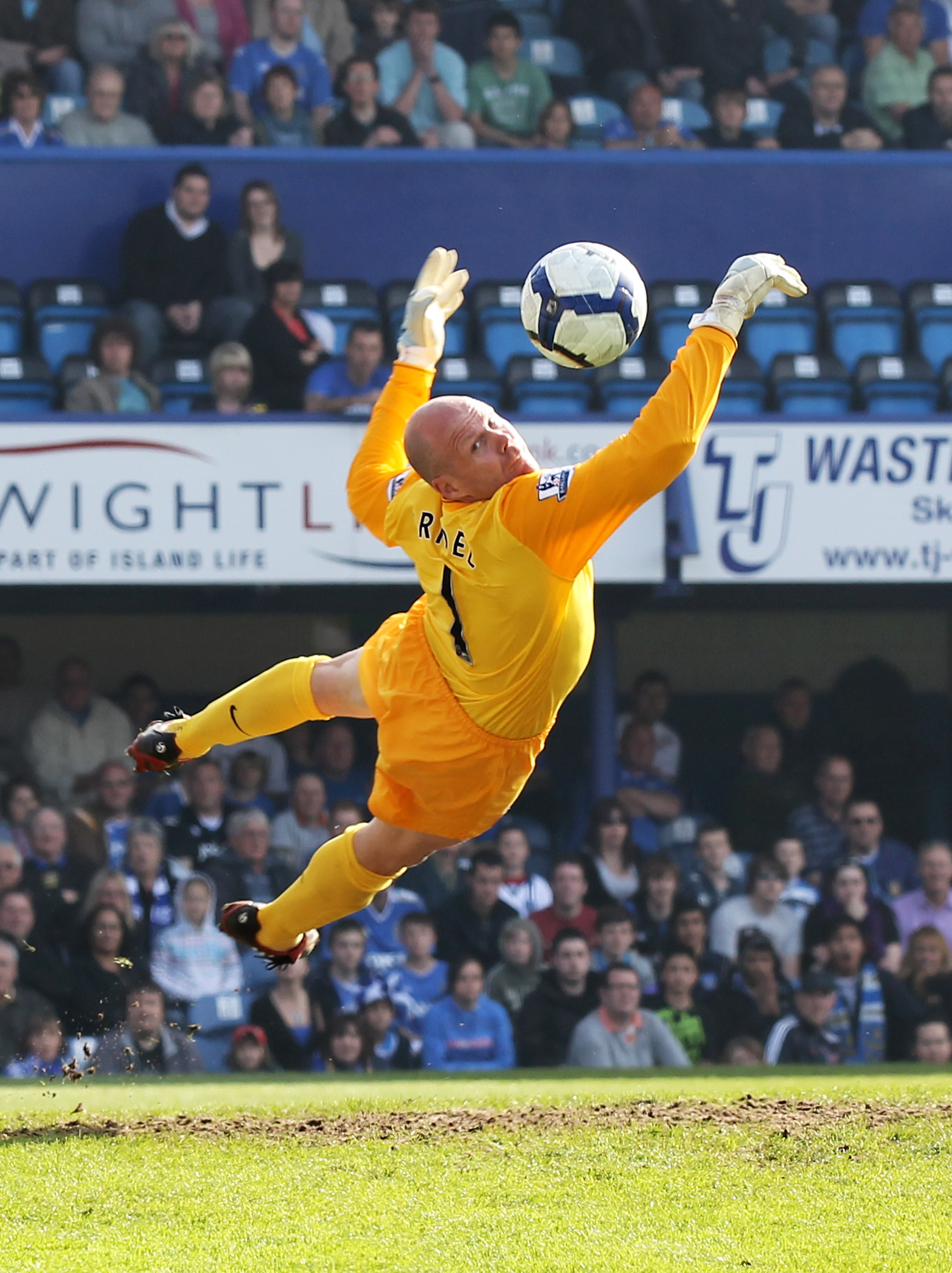 PORTSMOUTH, ENGLAND - APRIL 18: Goalkeeper Brad Friedel of Aston Villa makes a diving save during the Barclays Premier League match between Portsmouth and Aston Villa at Fratton Park on April 18, 2010 in Portsmouth, England.  (Photo by Phil Cole/Getty Ima