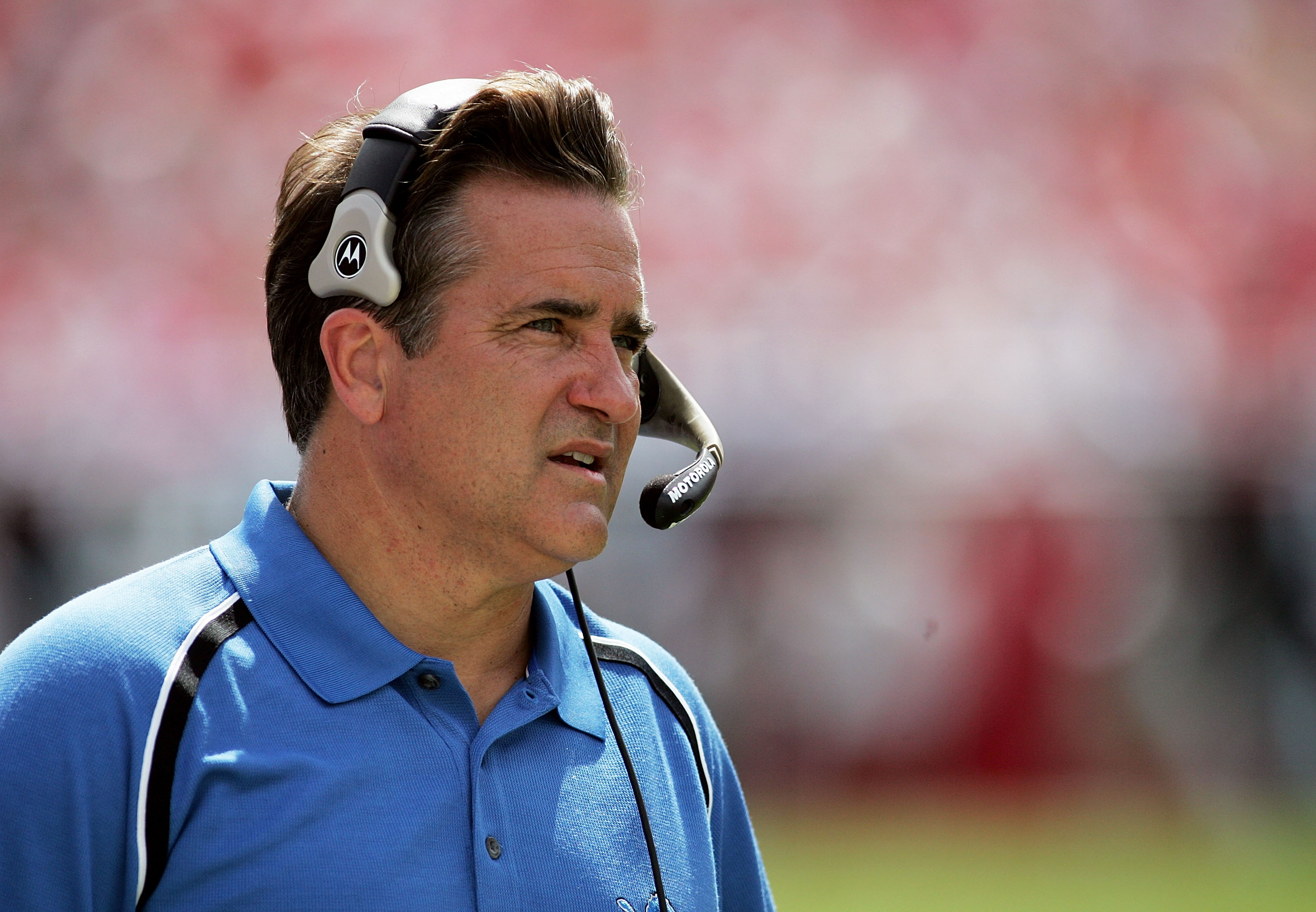 Detroit Lions coach Steve Mariucci watches the television replay