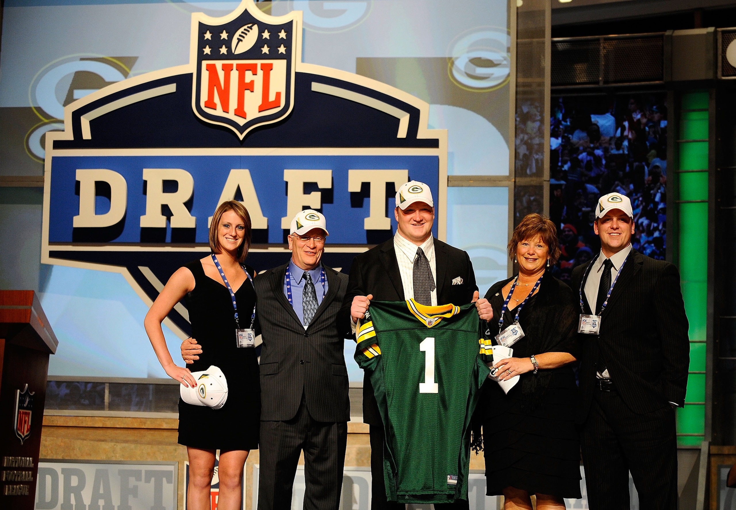 NEW YORK - APRIL 22:  Bryan Bulaga from the Iowa Hawkeyes holds up a Green Bay Packers jersey as he poses with friends and family after the Packers drafted him number 23 overall during the first round of the 2010 NFL Draft at Radio City Music Hall on Apri