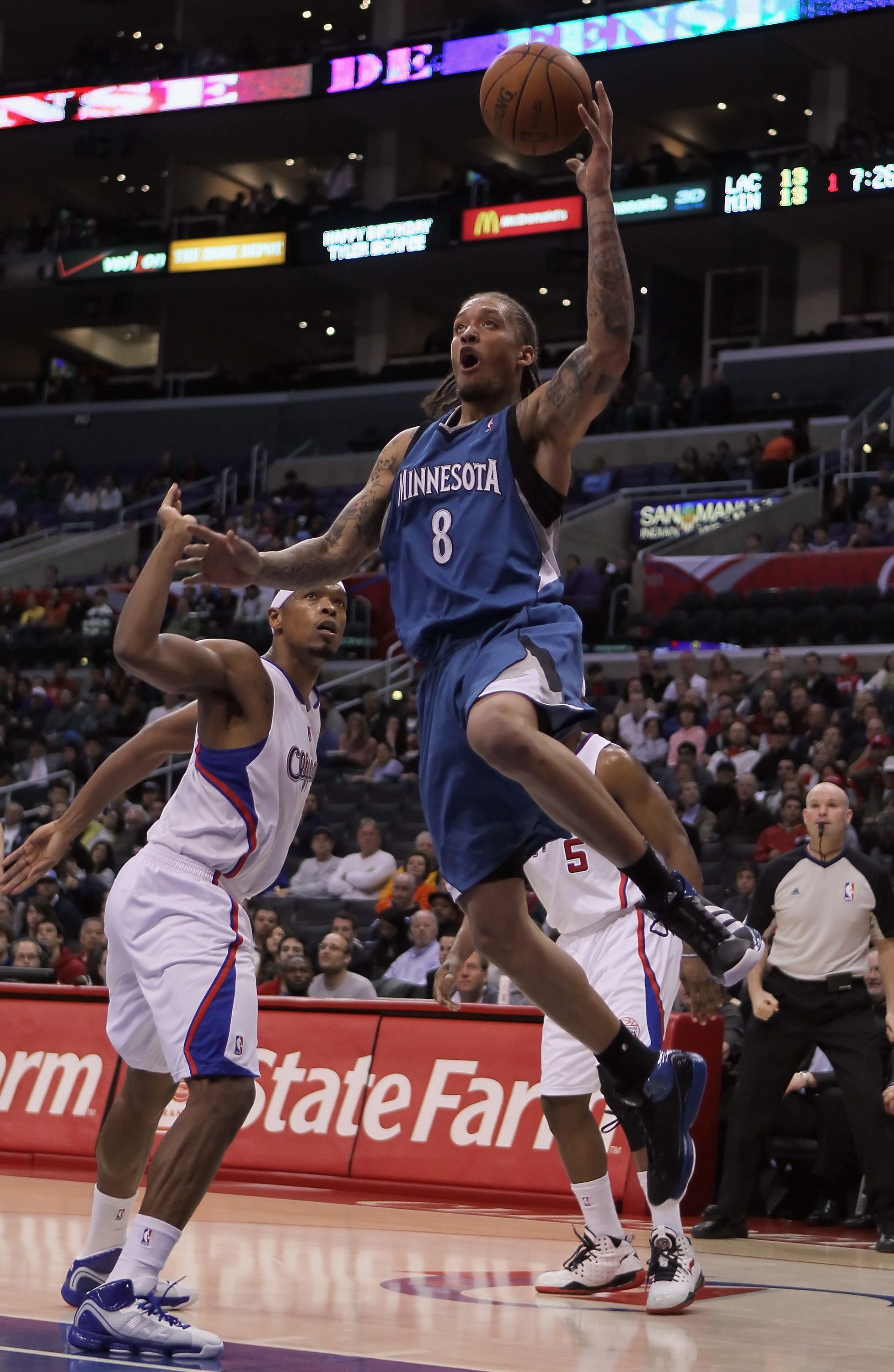 LOS ANGELES, CA - DECEMBER 20:  Michael Beasley #8 of the Minnesota Timberwolves drives to the basket past Ryan Gomes #15 of the Los Angeles Clippers during the first half at Staples Center on December 20, 2010 in Los Angeles, California. NOTE TO USER: Us