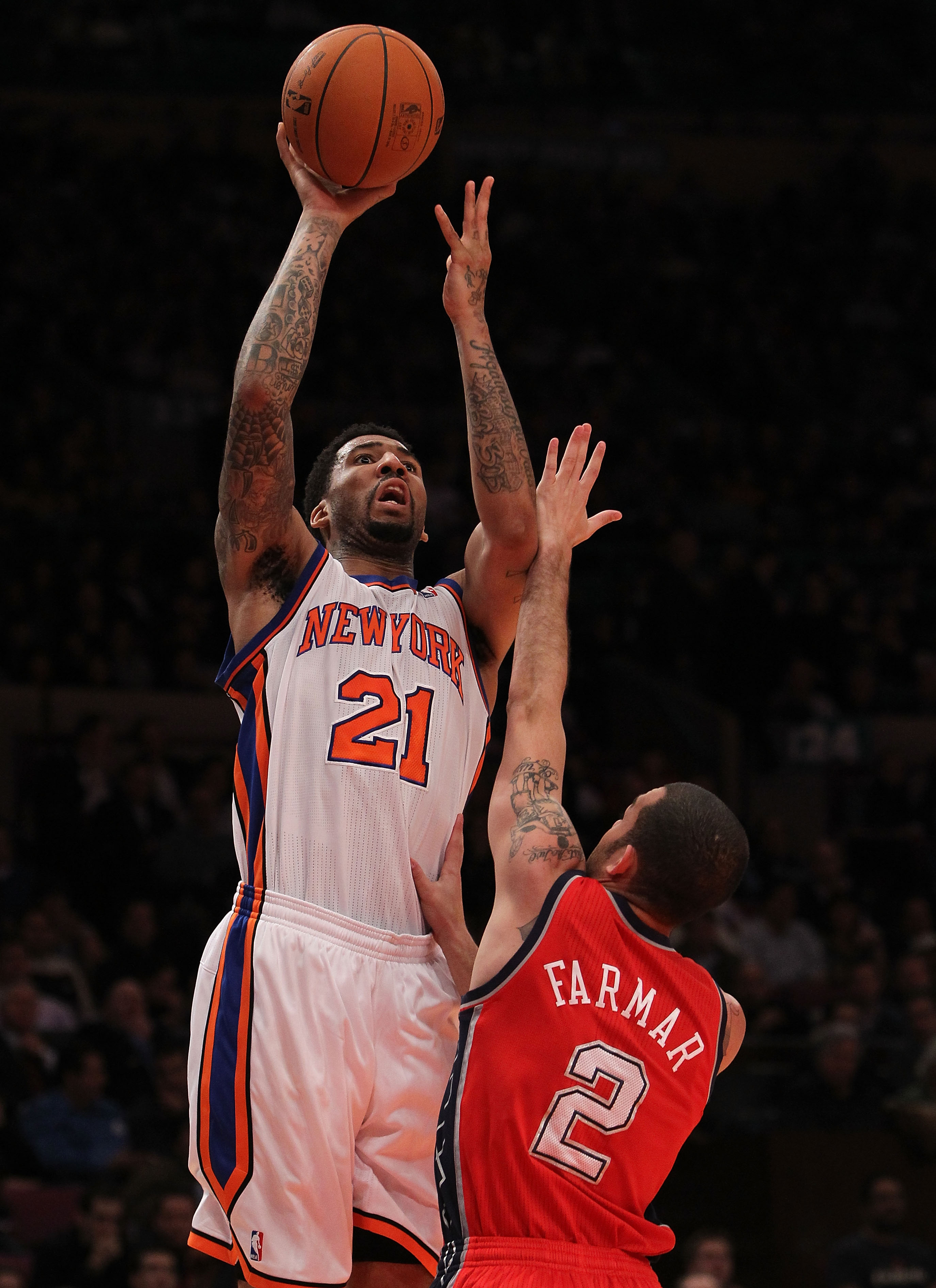 NEW YORK, NY - NOVEMBER 30:  Wilson Chandler #21 of the New York Knicks shoots the ball over Jordan Farmer #2 of the New Jersey Nets on November 30, 2010 at Madison Square Garden in New York City. NOTE TO USER: User expressly acknowledges and agrees that,