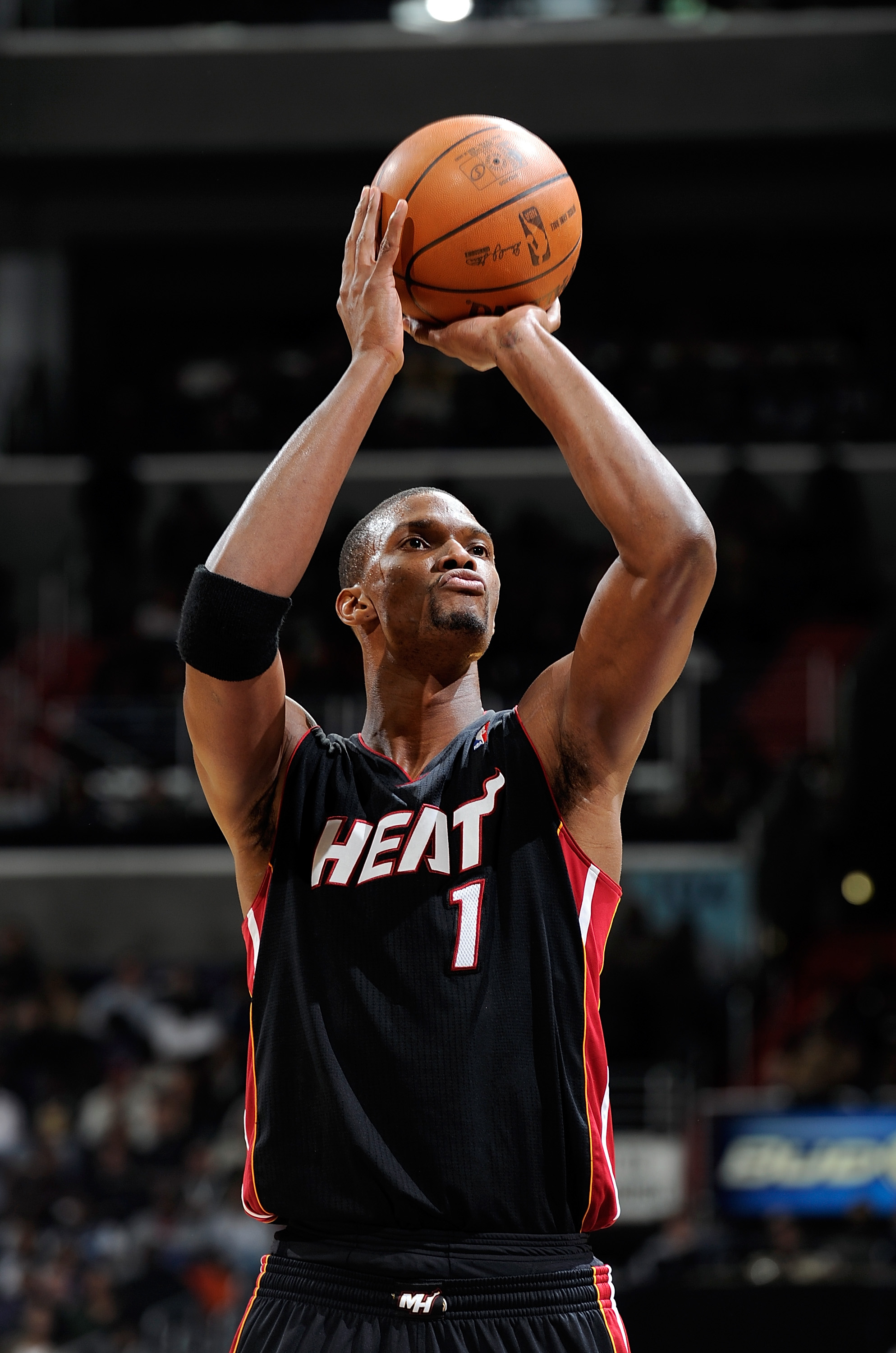 WASHINGTON, DC - DECEMBER 18:  Chris Bosh #1 of the Miami Heat shoots a free throw against the Washington Wizards at the Verizon Center on December 18, 2010 in Washington, DC. NOTE TO USER: User expressly acknowledges and agrees that, by downloading and o