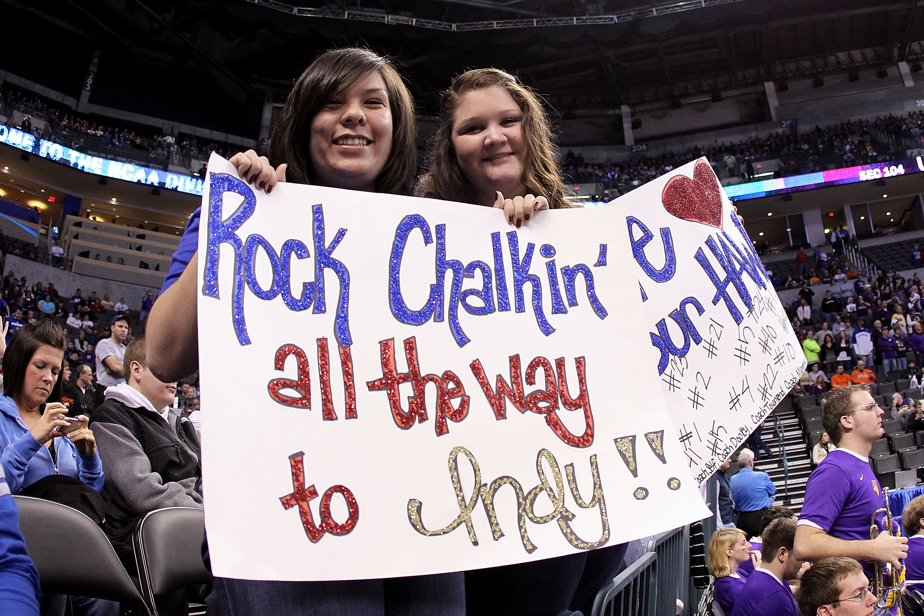 OKLAHOMA CITY - MARCH 20:  Fans of the Kansas Jayhawks hold up signs which read 'Rock Chalkin all the way to Indy' against the Northern Iowa Panthers during the second round of the 2010 NCAA men's basketball tournament at Ford Center on March 20, 2010 in