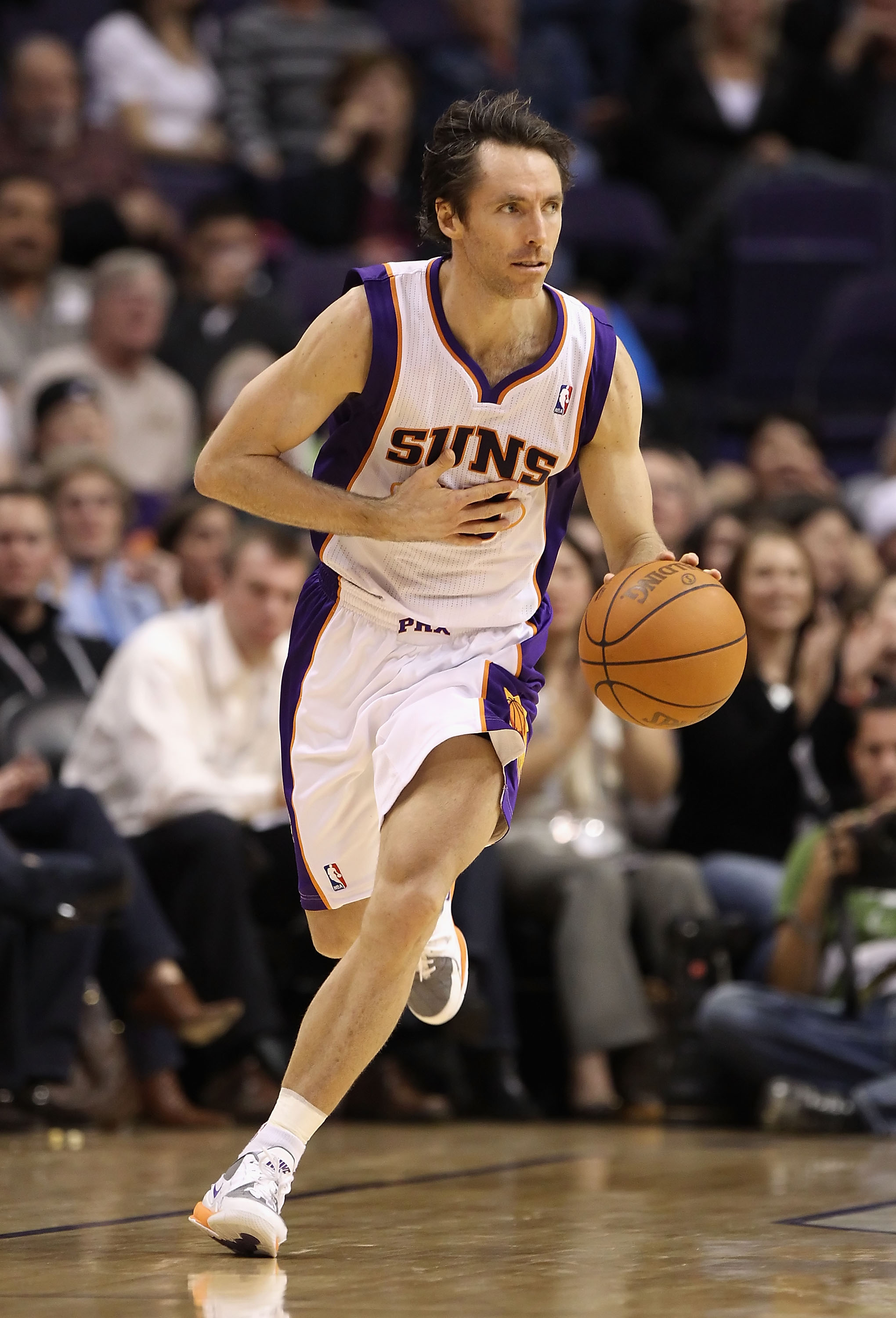 PHOENIX - DECEMBER 15:  Steve Nash #13 of the Phoenix Suns moves the ball upcourt during the NBA game against the Minnesota Timberwolves at US Airways Center on December 15, 2010 in Phoenix, Arizona.  The Suns defeated the Timberwolves 128-122.  NOTE TO U