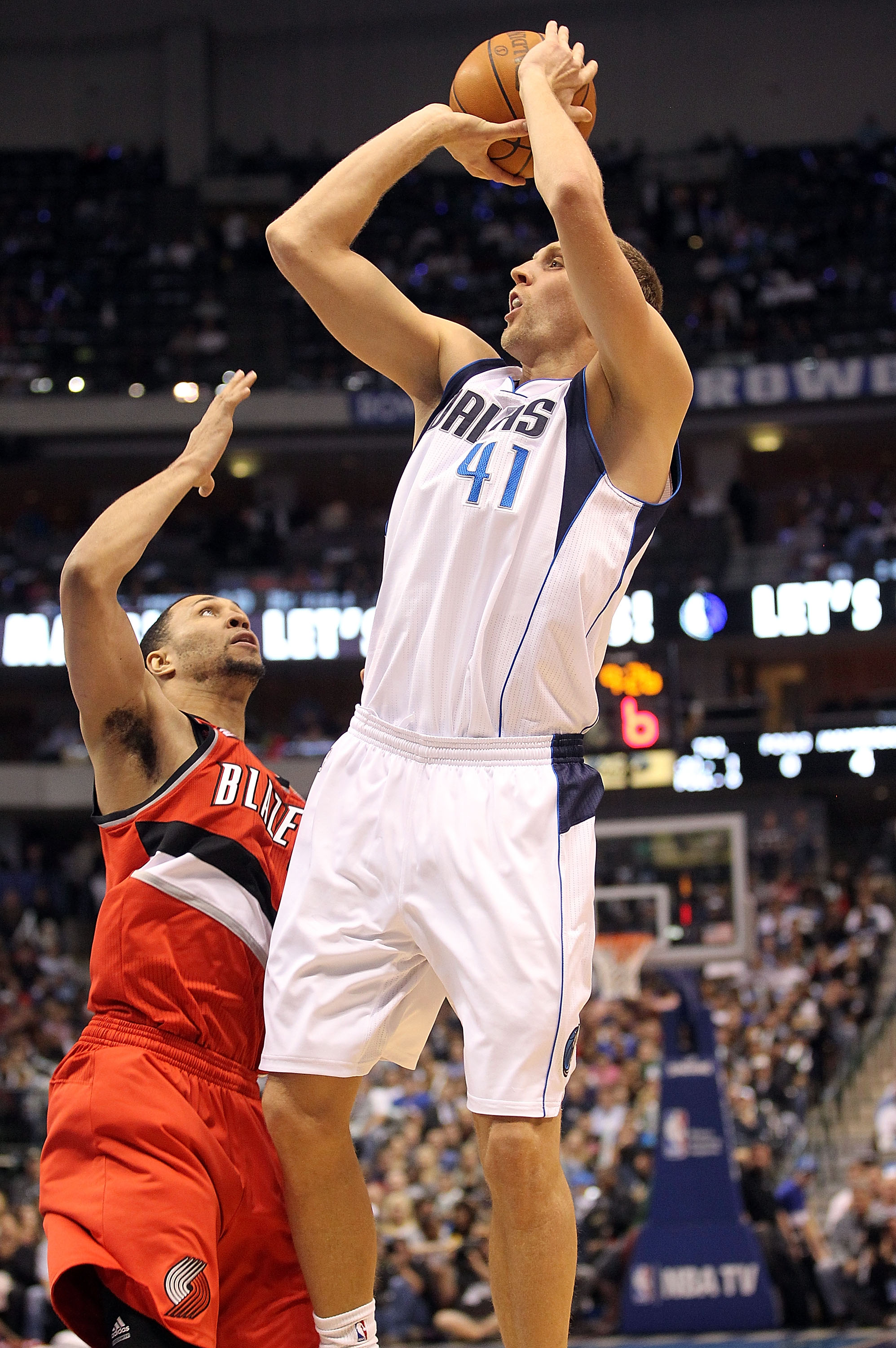 DALLAS, TX - DECEMBER 15: Forward Dirk Nowitzki #41 of the Dallas Mavericks takes a shot against Brandon Roy #7 of the Portland Trail Blazers at American Airlines Center on December 15, 2010 in Dallas, Texas.  NOTE TO USER: User expressly acknowledges and