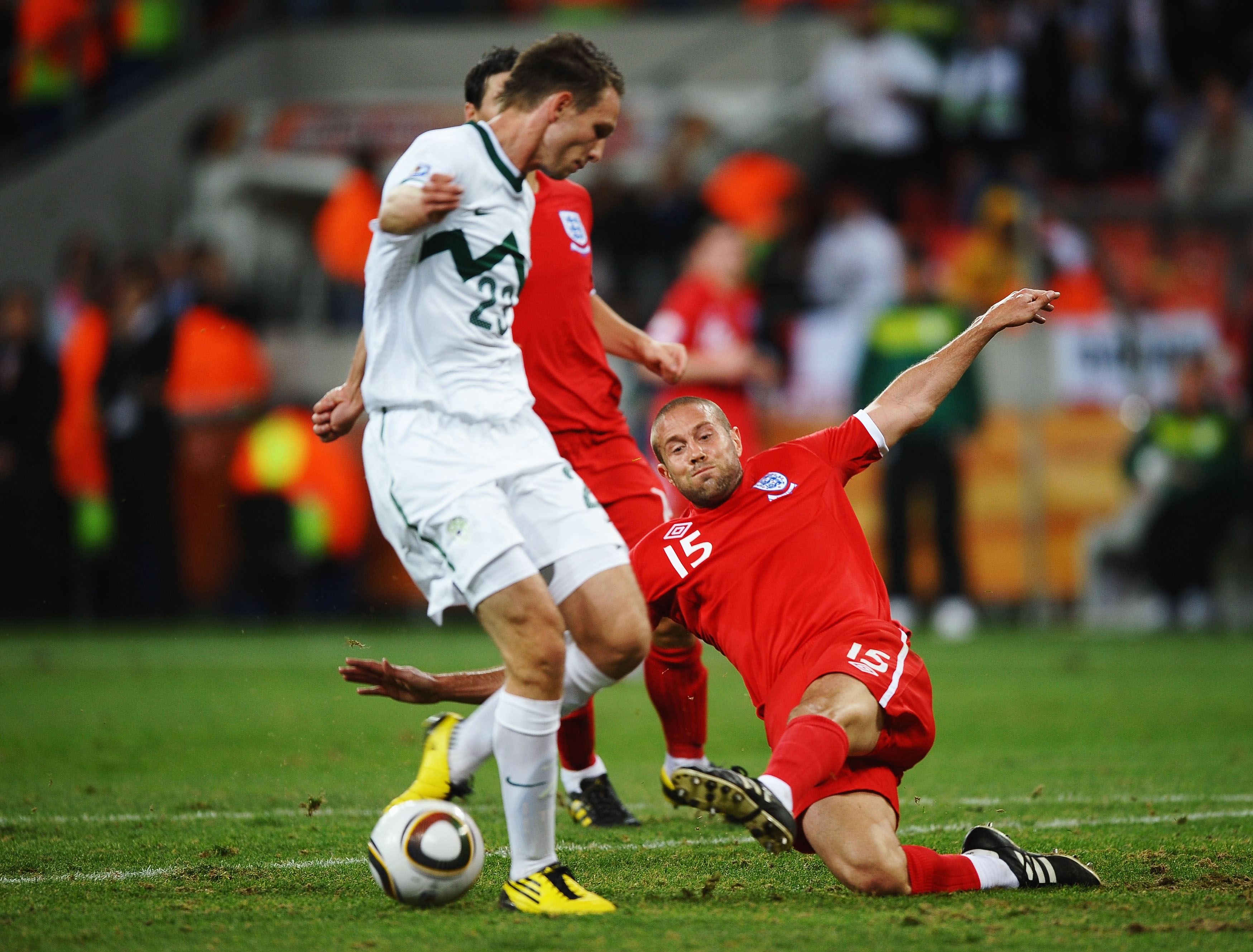 PORT ELIZABETH, SOUTH AFRICA - JUNE 23: Matthew Upson of England tackles Tim Matavz of Slovenia during the 2010 FIFA World Cup South Africa Group C match between Slovenia and England at the Nelson Mandela Bay Stadium on June 23, 2010 in Port Elizabeth, So