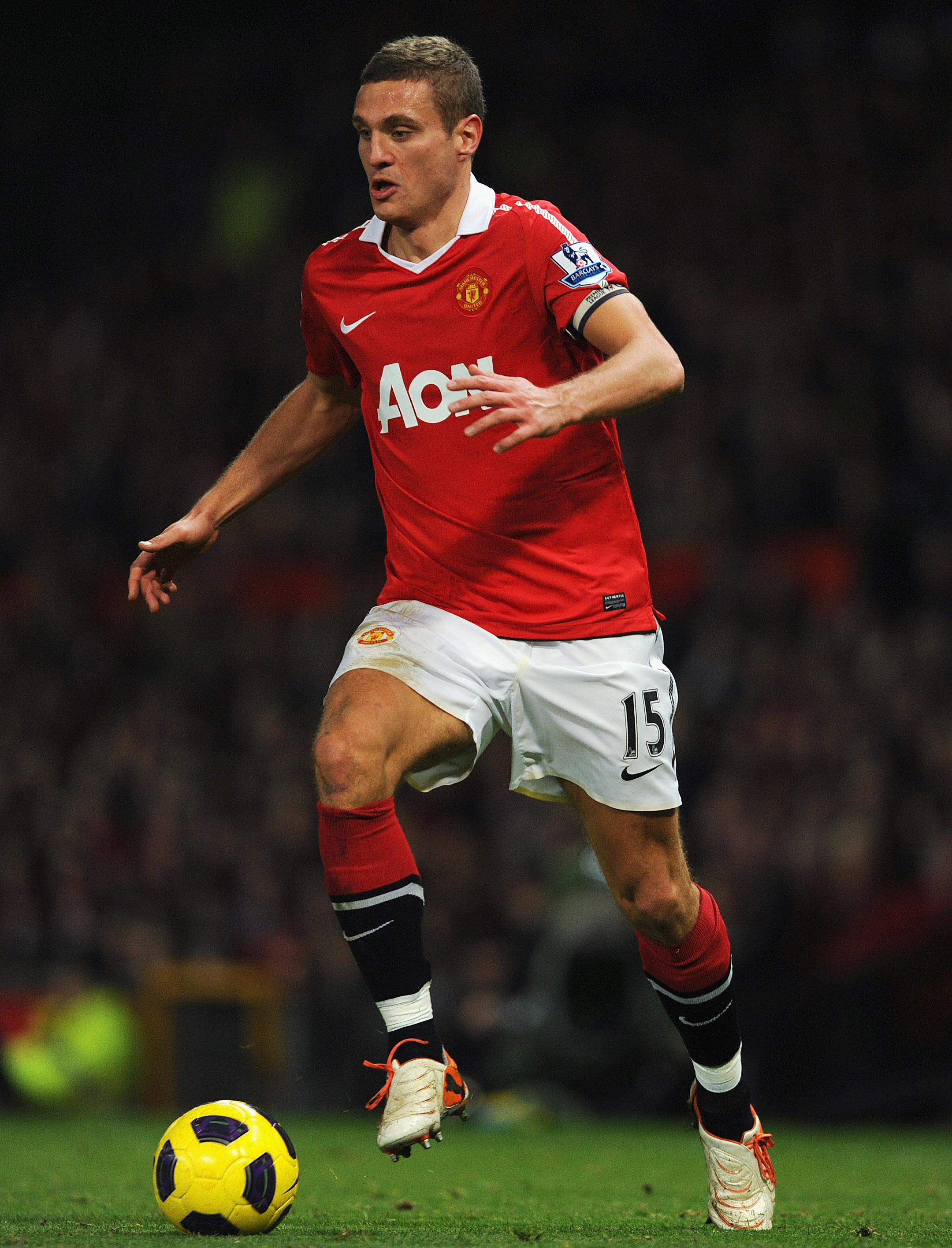 MANCHESTER, ENGLAND - NOVEMBER 20: Nemanja Vidic of Manchester United plays the ball during the Barclays Premier League match between Manchester United and Wigan Athletic at Old Trafford on November 20, 2010 in Manchester, England.  (Photo by Michael Rega