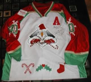 Minor-league team sports festive jerseys for Christmas in July