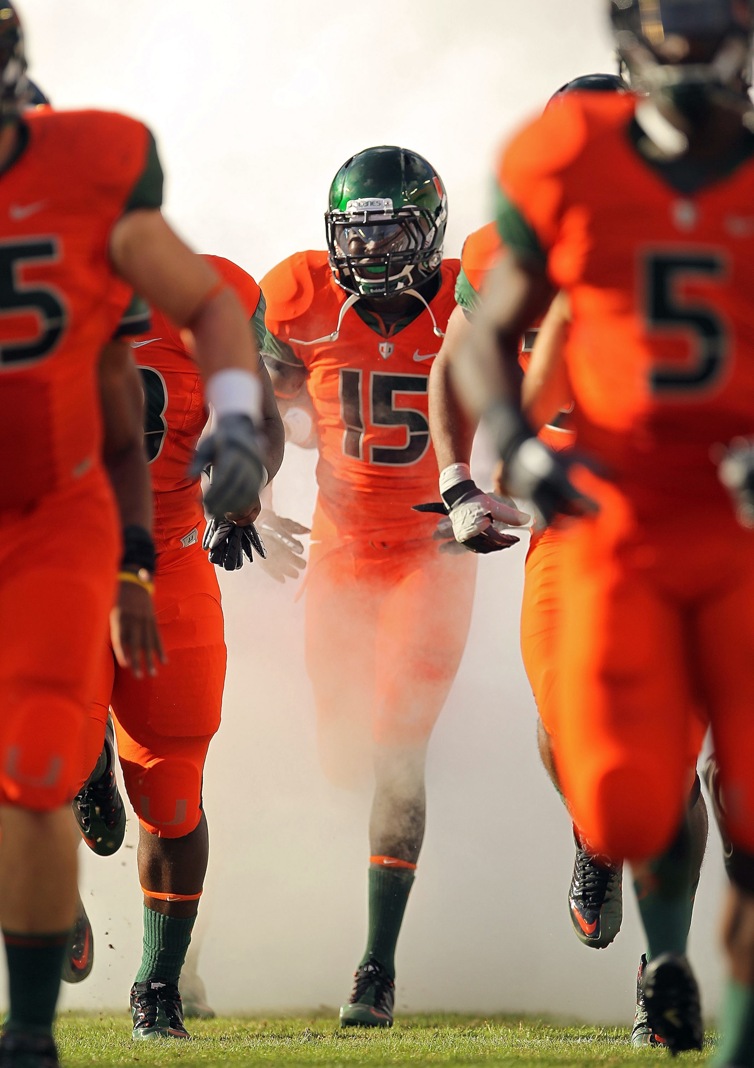 MIAMI - NOVEMBER 20: Jamal Reid #15 of the Miami Hurricanes runs out of the tunnel during a game against the Virginia Tech Hokies at Sun Life Stadium on November 20, 2010 in Miami, Florida.  (Photo by Mike Ehrmann/Getty Images)