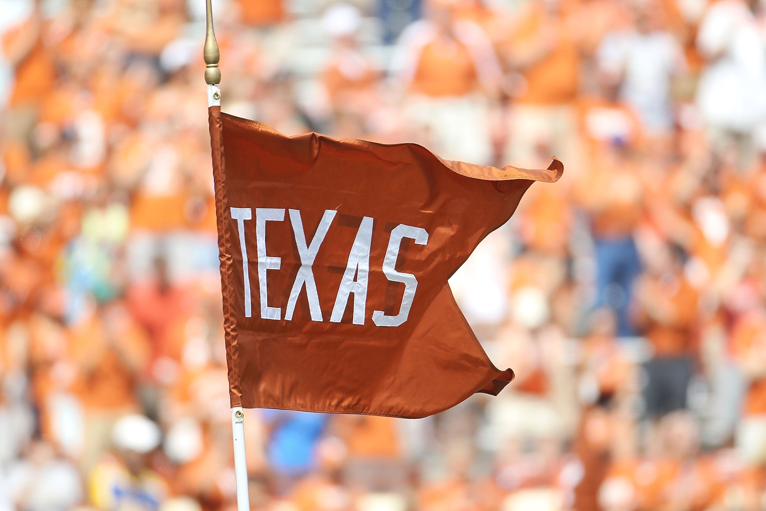 AUSTIN, TX - SEPTEMBER 25:  A flag for the Texas Longhorns waves at Darrell K Royal-Texas Memorial Stadium on September 25, 2010 in Austin, Texas.  (Photo by Ronald Martinez/Getty Images)
