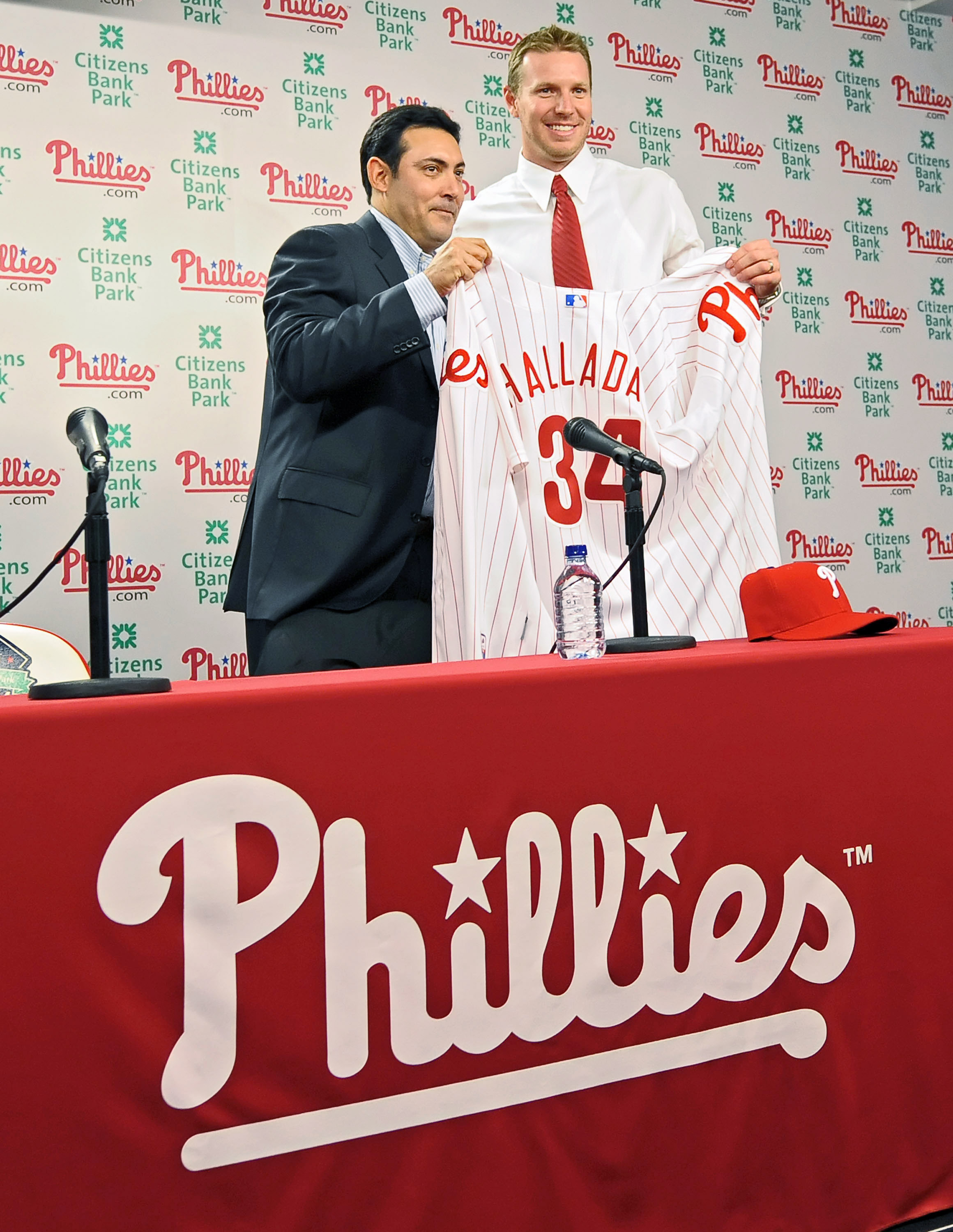PHILADELPHIA - DECEMBER 16: Pitcher Roy Halladay of the Philadelphia Phillies and senior vice president and general manager Ruben Amaro, Jr. pose for a photograph on December 16, 2009 at Citizens Bank Park in Philadelphia, Pennsylvania. (Photo by Drew Hal