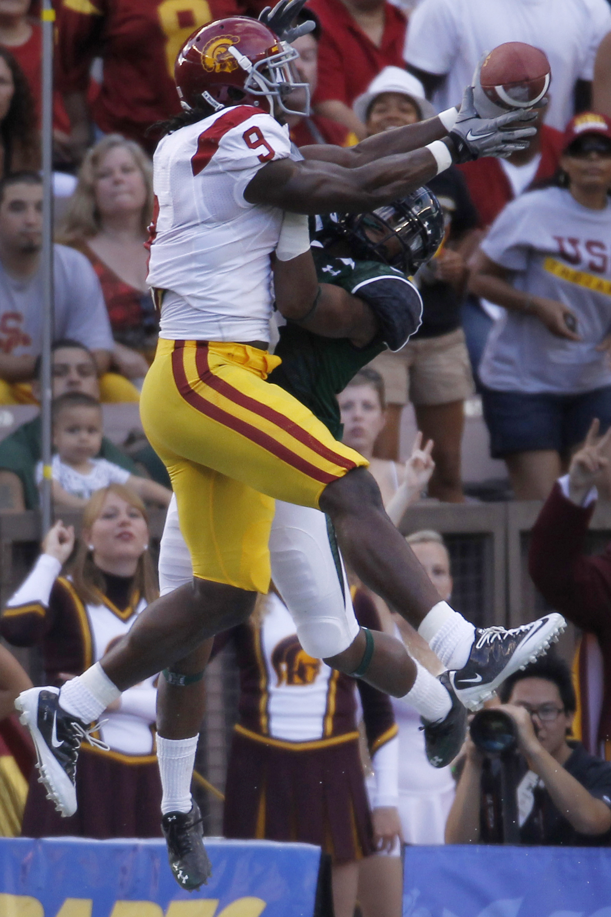 HONOLULU - SEPTEMBER 02: David Ausberry #9 of the University of Southern California Trojans tries to reel in a pass from teammate Matt Barkley during first half action at Aloha Stadium September 2, 2010 in Honolulu, Hawaii. (Photo by Kent Nishimura/Getty